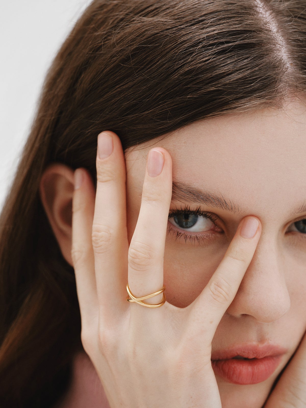 Double Crossed Ring made of 925 Silver coated in 18K Yellow Gold.