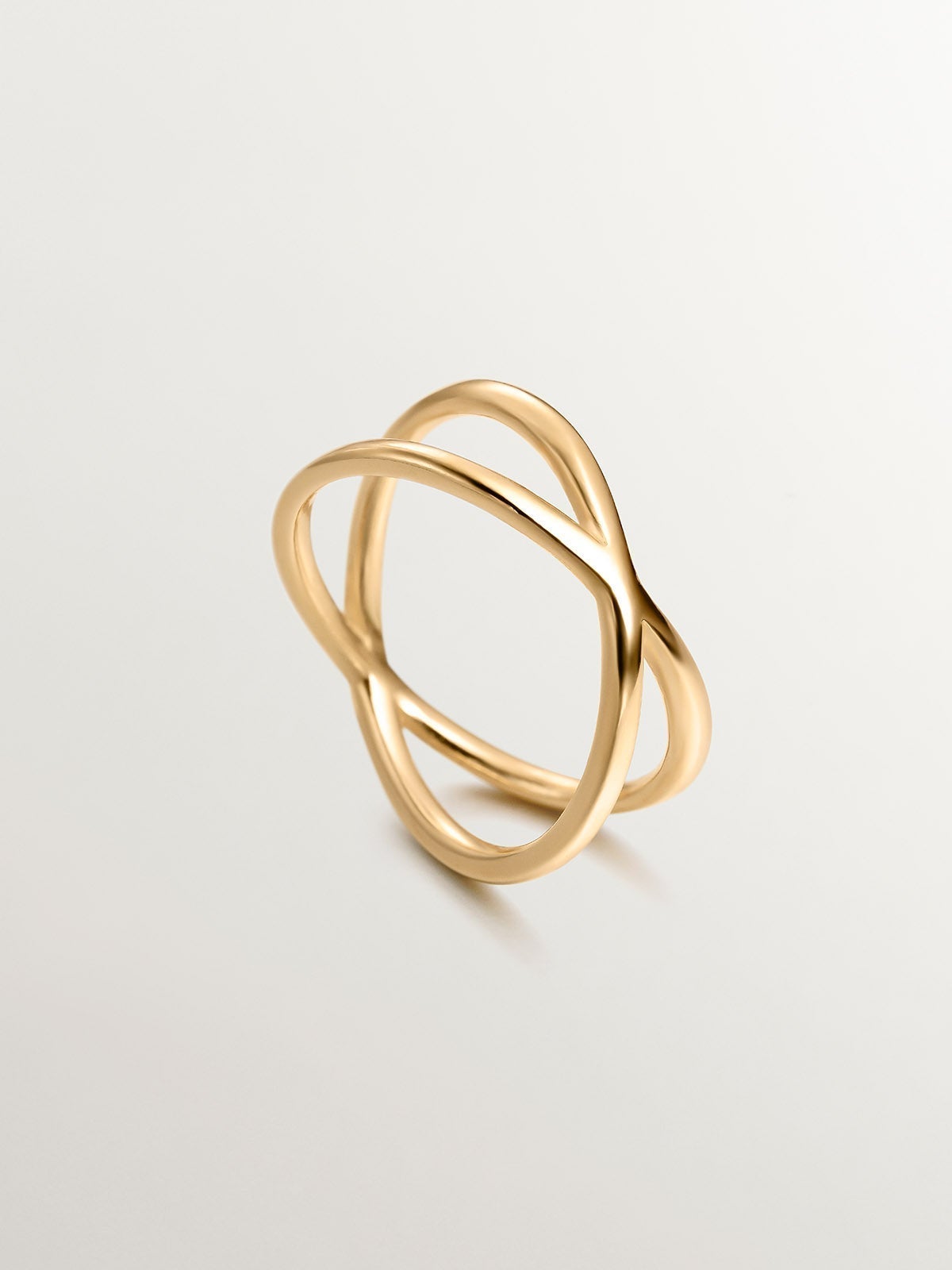 Double Crossed Ring made of 925 Silver coated in 18K Yellow Gold.