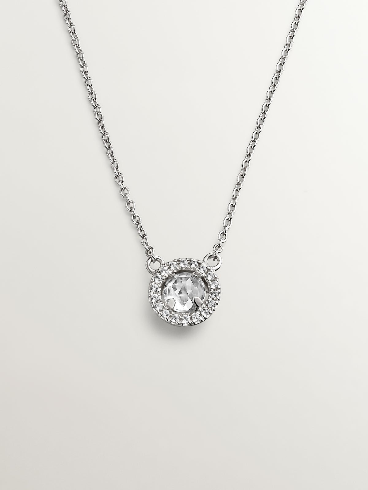 925 Silver Pendant with white topaz and border of white sapphires.