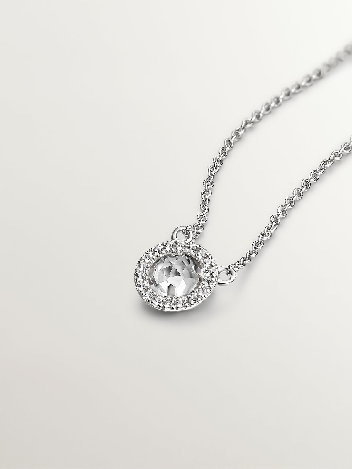 925 Silver Pendant with white topaz and border of white sapphires.
