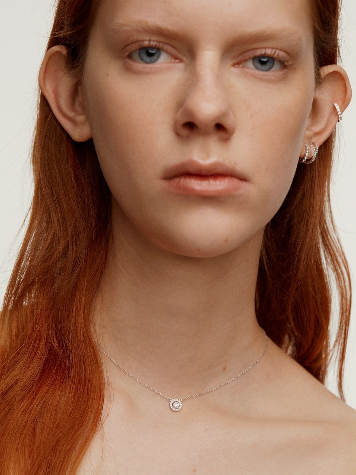 925 Silver Pendant with white topaz and border of white sapphires.