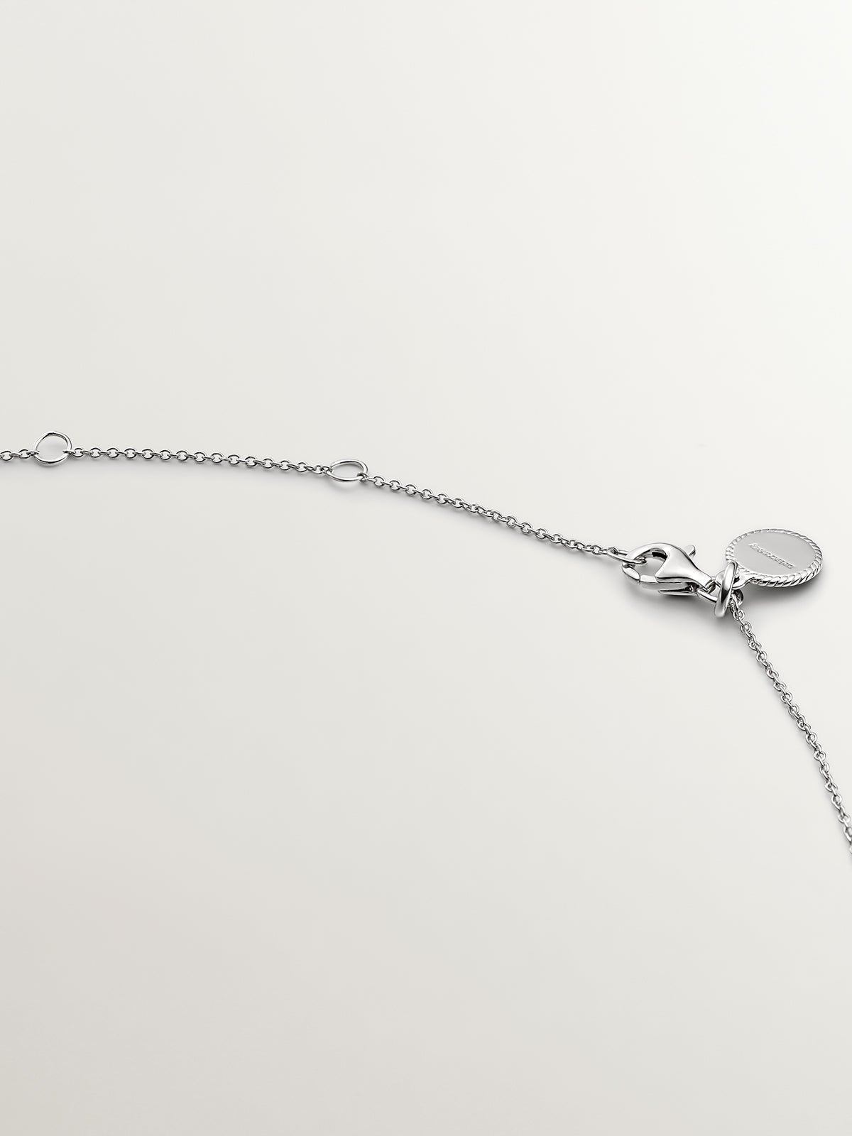 925 Silver Pendant with white topaz and border of white sapphires.