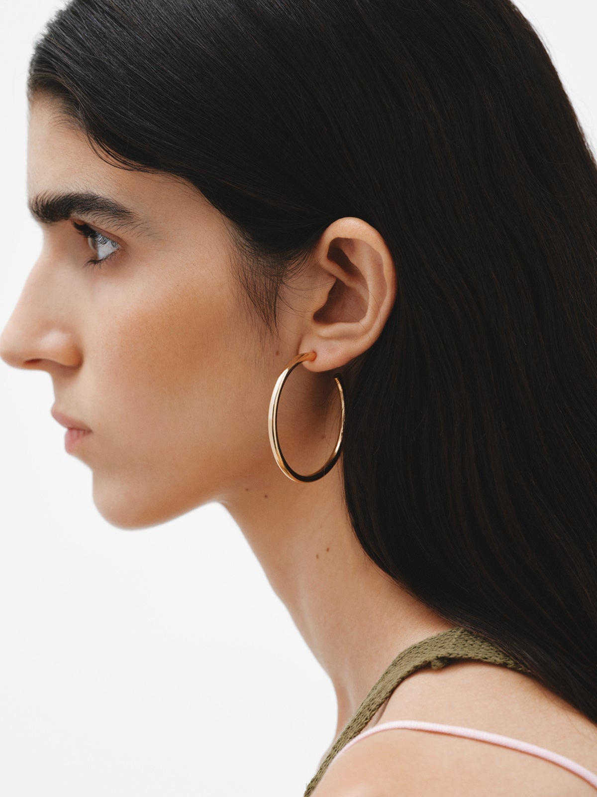 Large hoop earrings made of 925 silver, coated in 18K yellow gold.