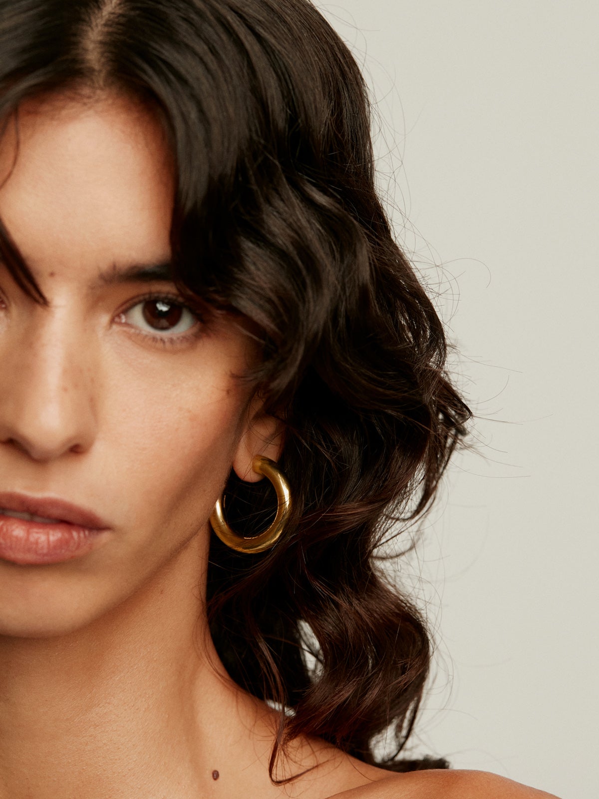 Thick hoop earrings made of 925 silver plated in 18K yellow gold
