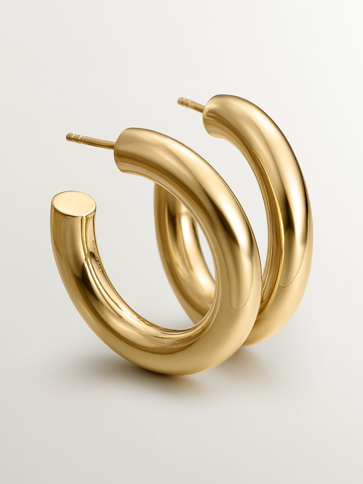 Thick hoop earrings made of 925 silver plated in 18K yellow gold