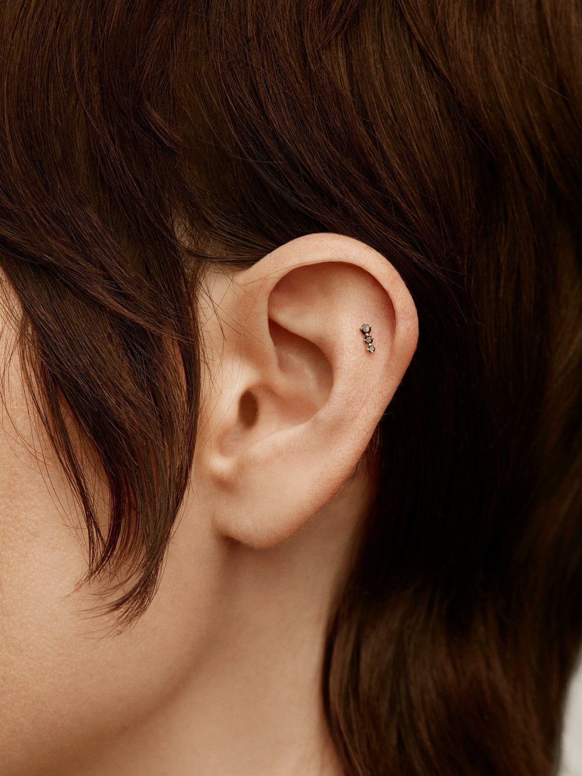 18K white gold piercing with black diamonds