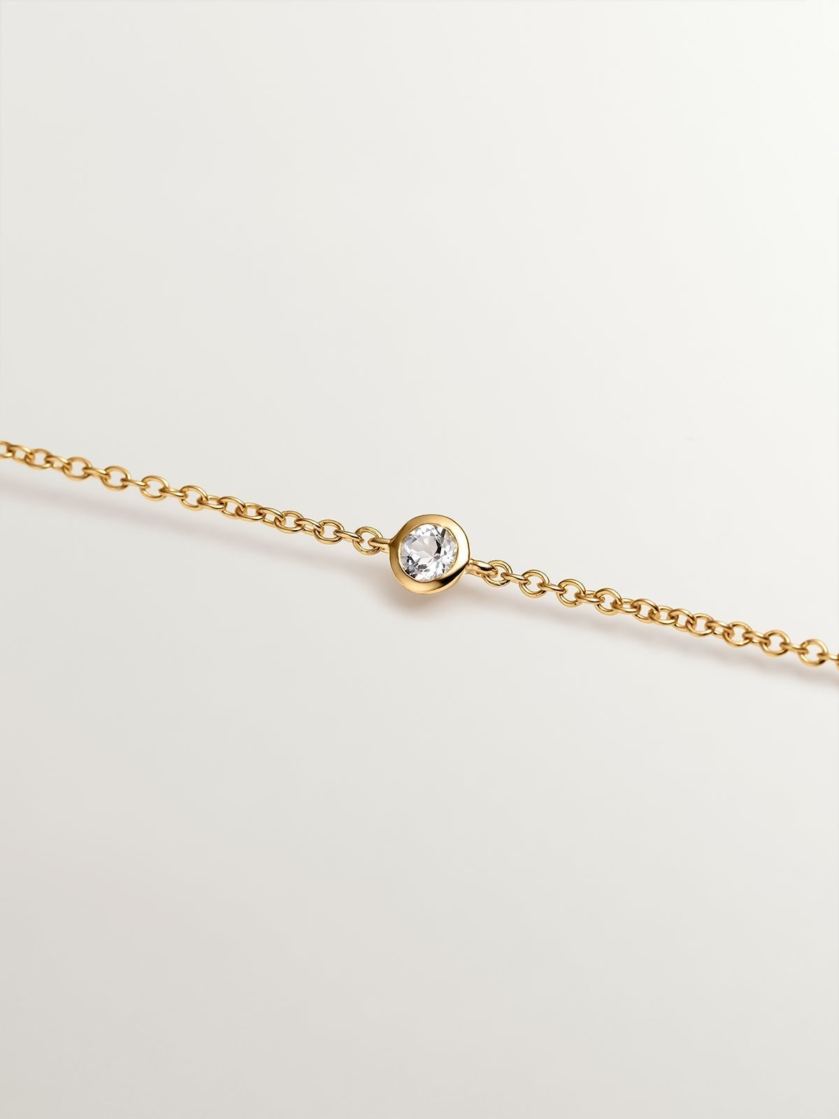 18K yellow gold plated 925 silver solitaire bracelet with white topaz.