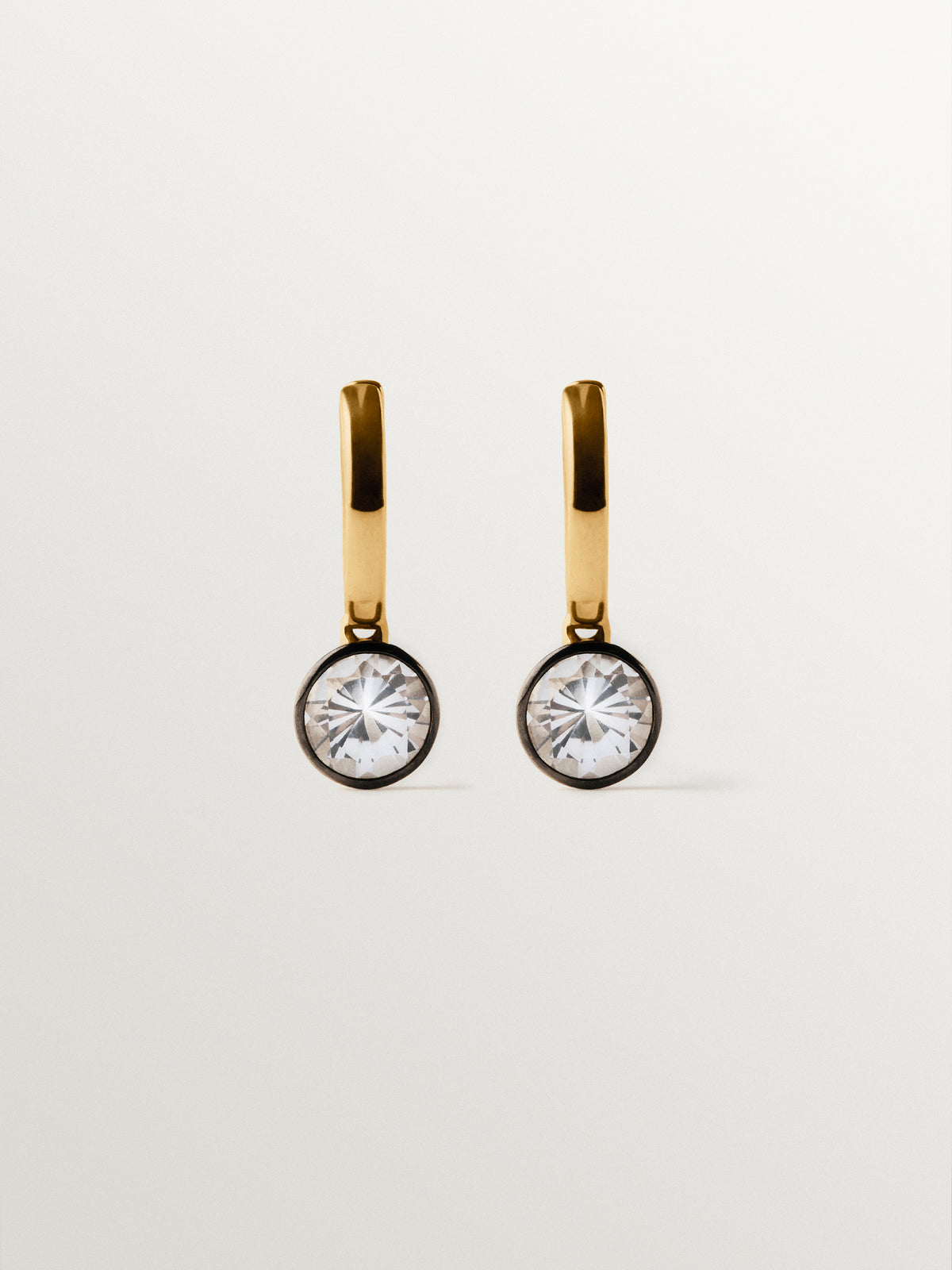 Two-tone hoop earrings in 925 silver plated in 18K yellow gold with white topaz