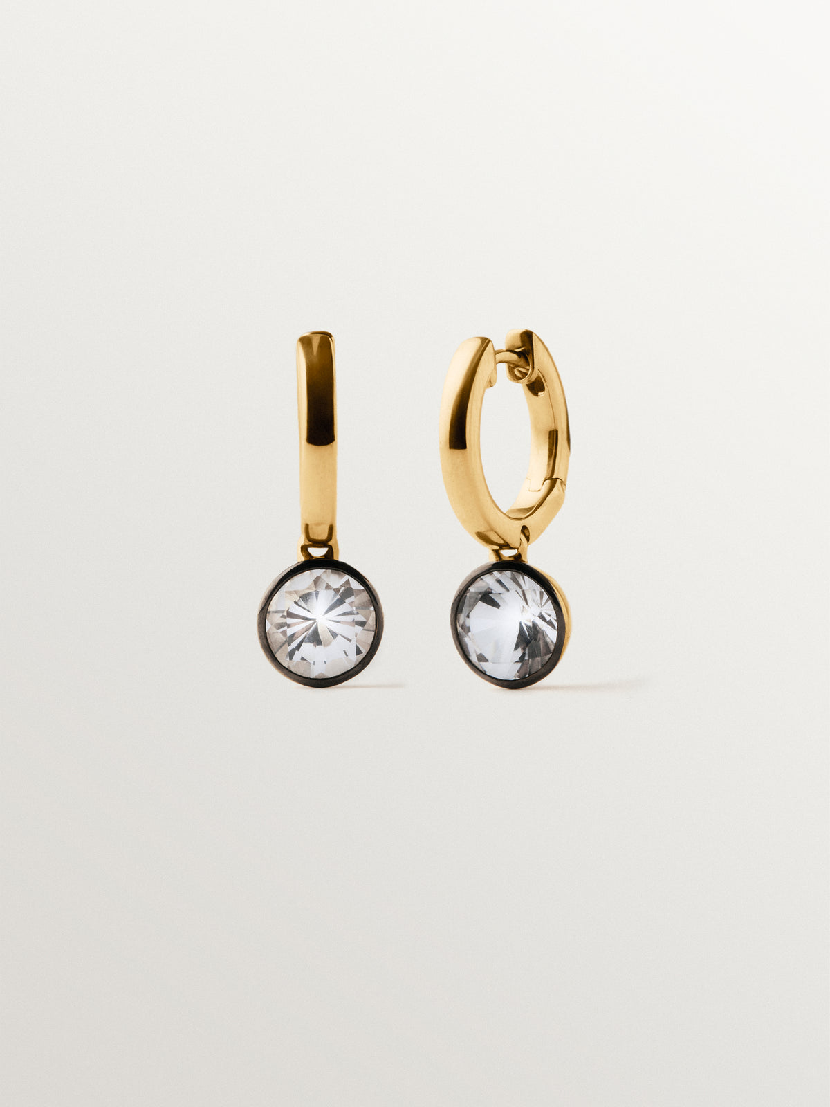 Two-tone hoop earrings in 925 silver plated in 18K yellow gold with white topaz
