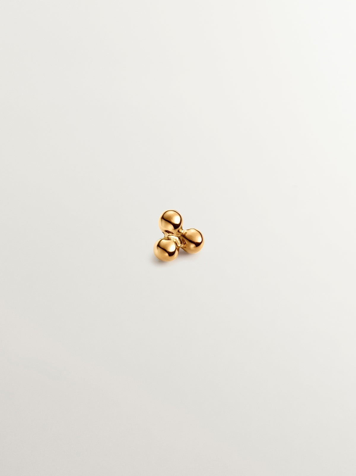 18K yellow gold piercing with triple bead