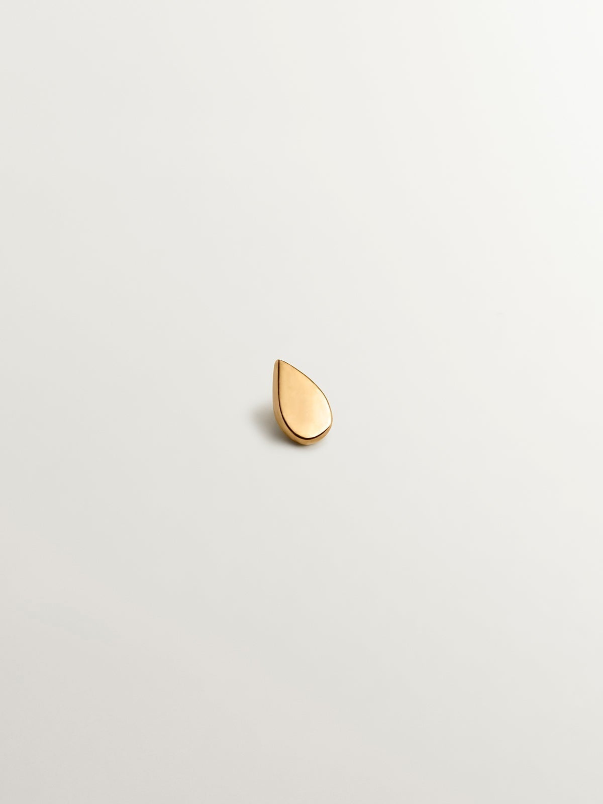 18K yellow gold piercing with a tear-drop shape