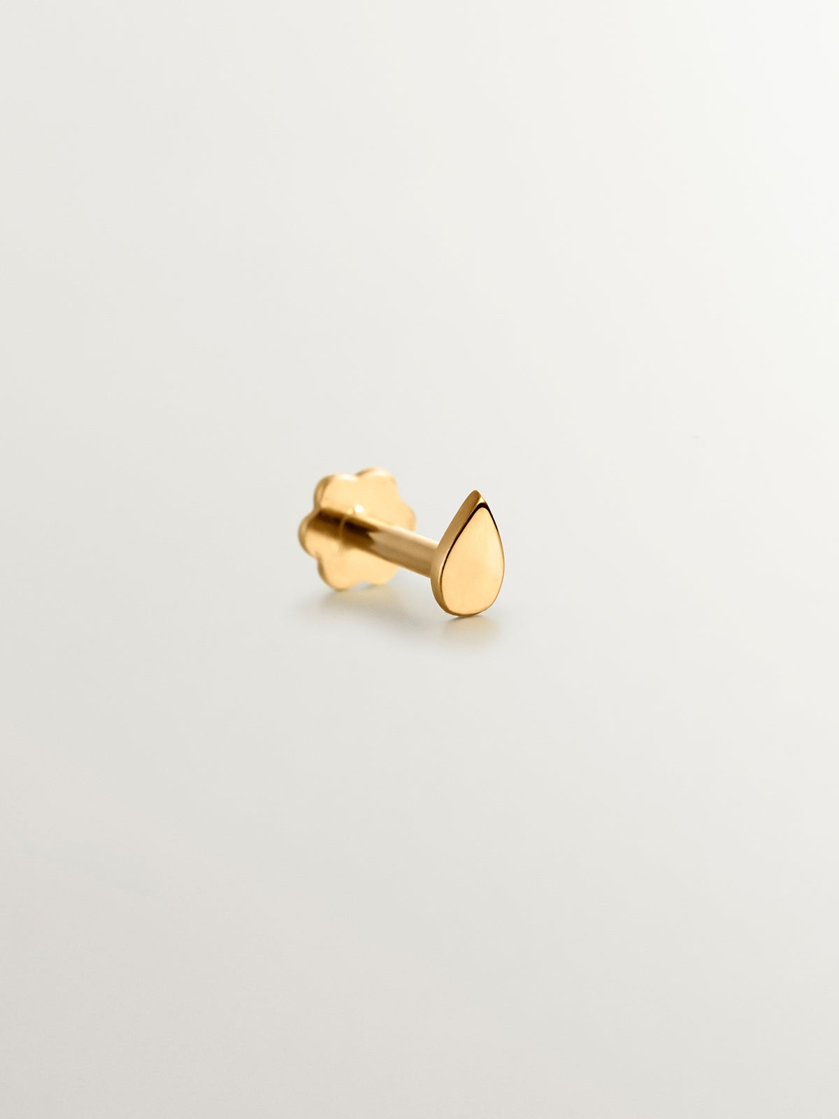 18K yellow gold piercing with a tear-drop shape