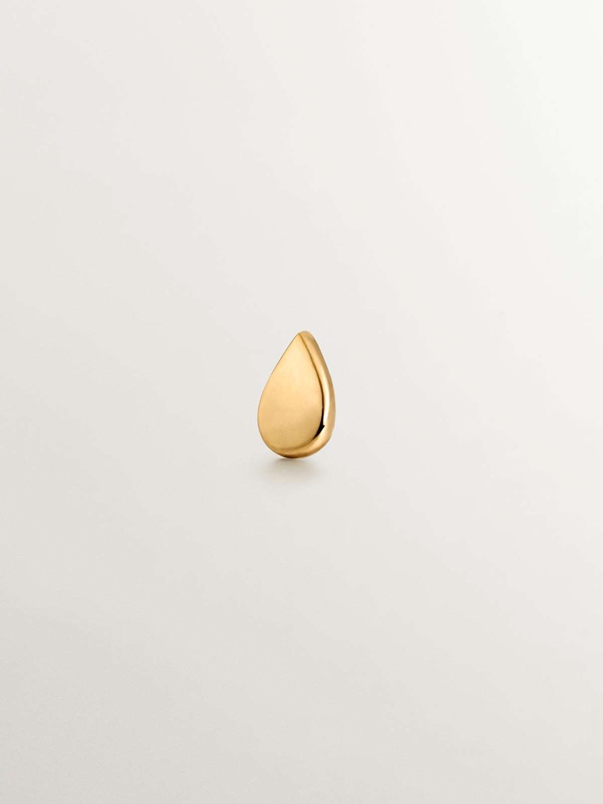 18K yellow gold piercing with a tear-drop shape