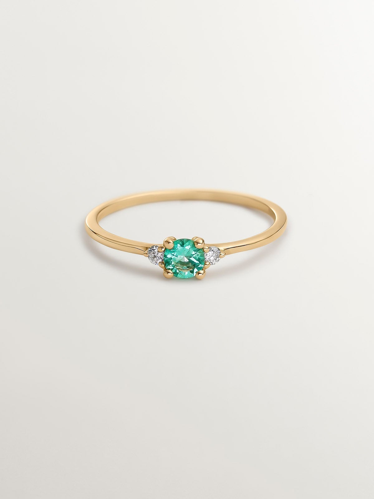 9K Yellow Gold Trilogy Ring with Emerald and Diamonds