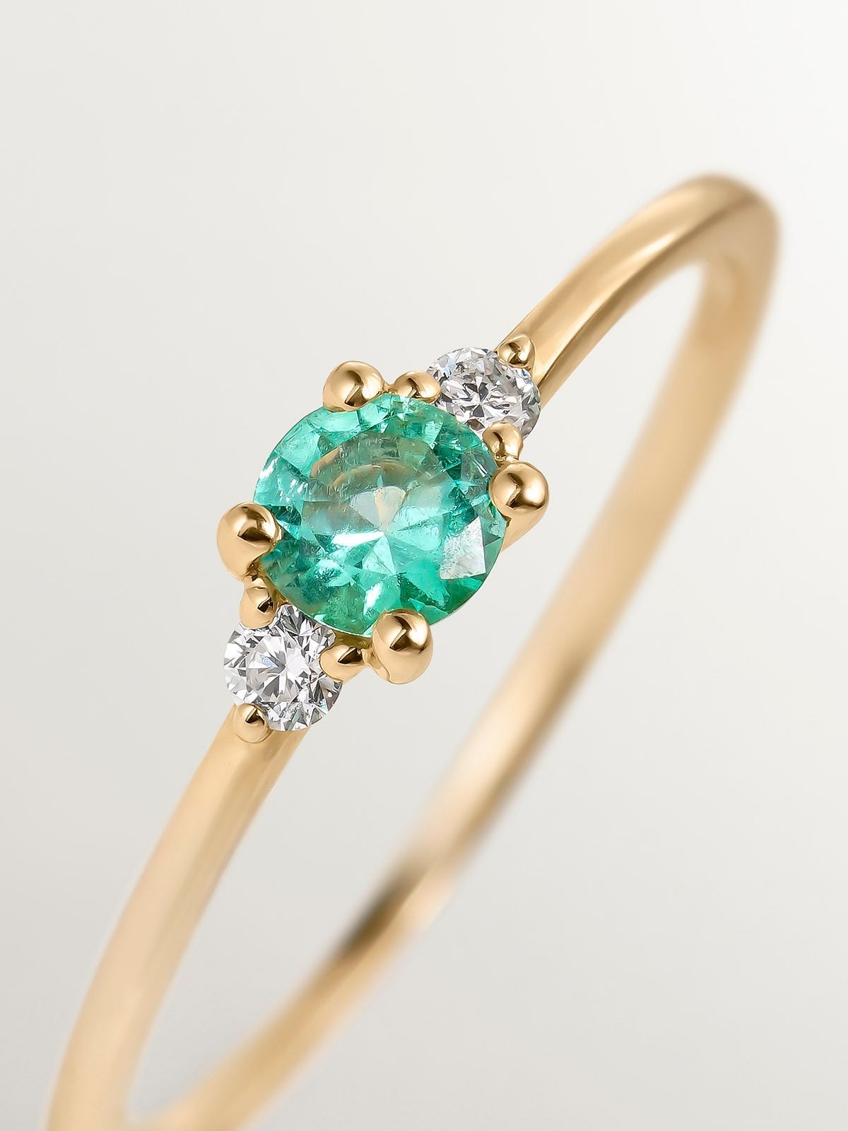 9K Yellow Gold Trilogy Ring with Emerald and Diamonds