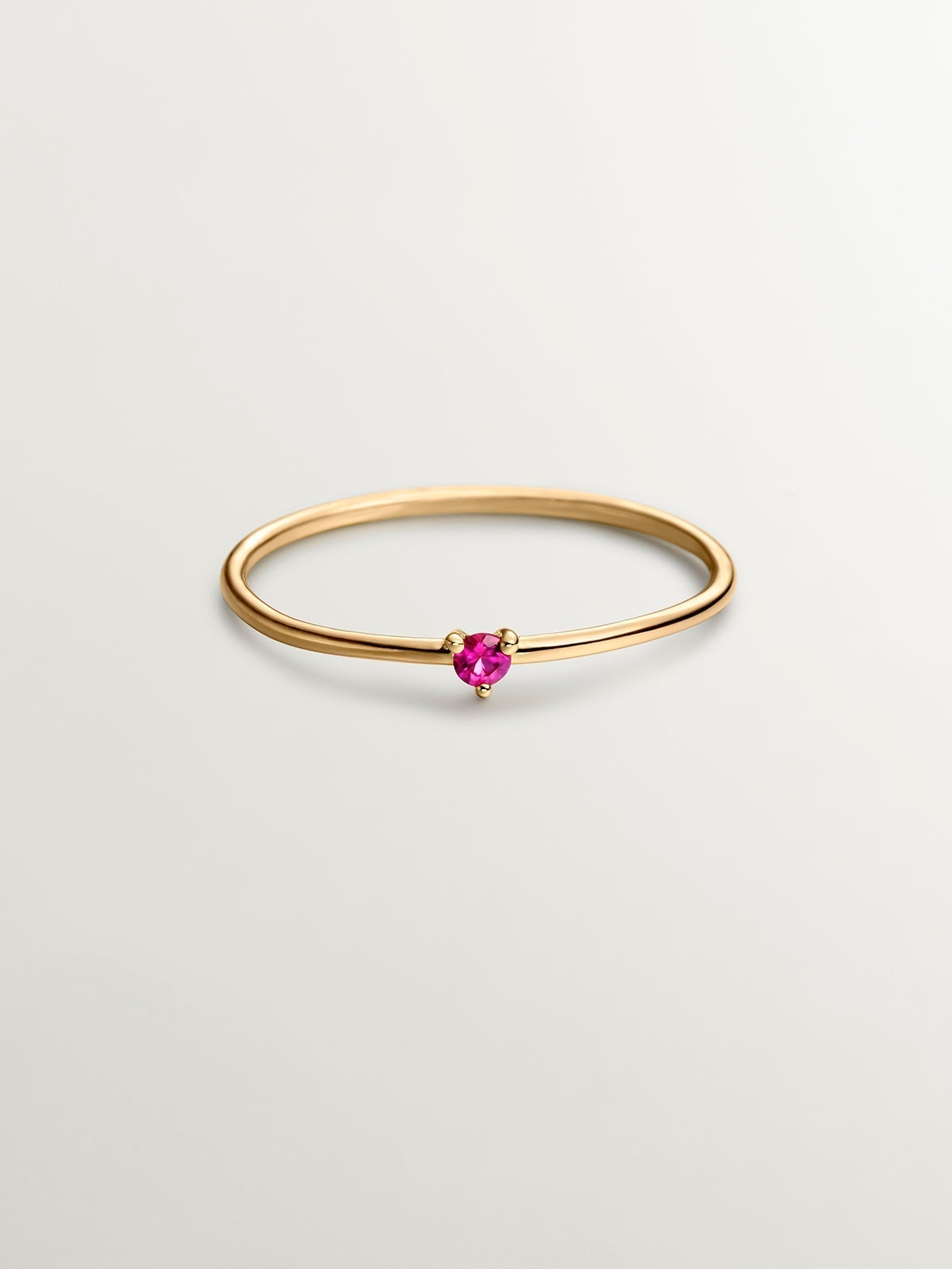 9K yellow gold solitaire ring with red ruby