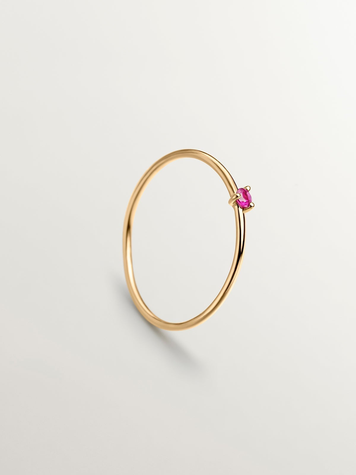 9K yellow gold solitaire ring with red ruby