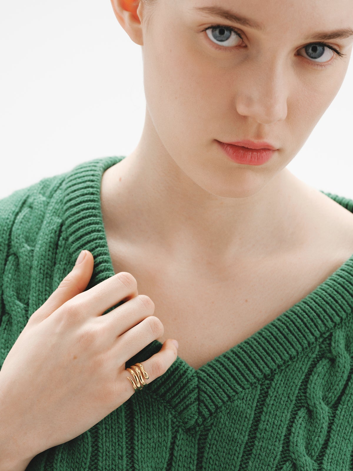 925 Silver triple ring bathed in 18K yellow gold with a snake shape and white topazes.