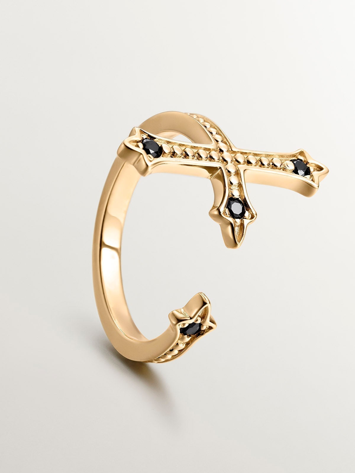 You and Me ring made of 925 silver, bathed in 18K yellow gold, cross-shaped with black spinels.