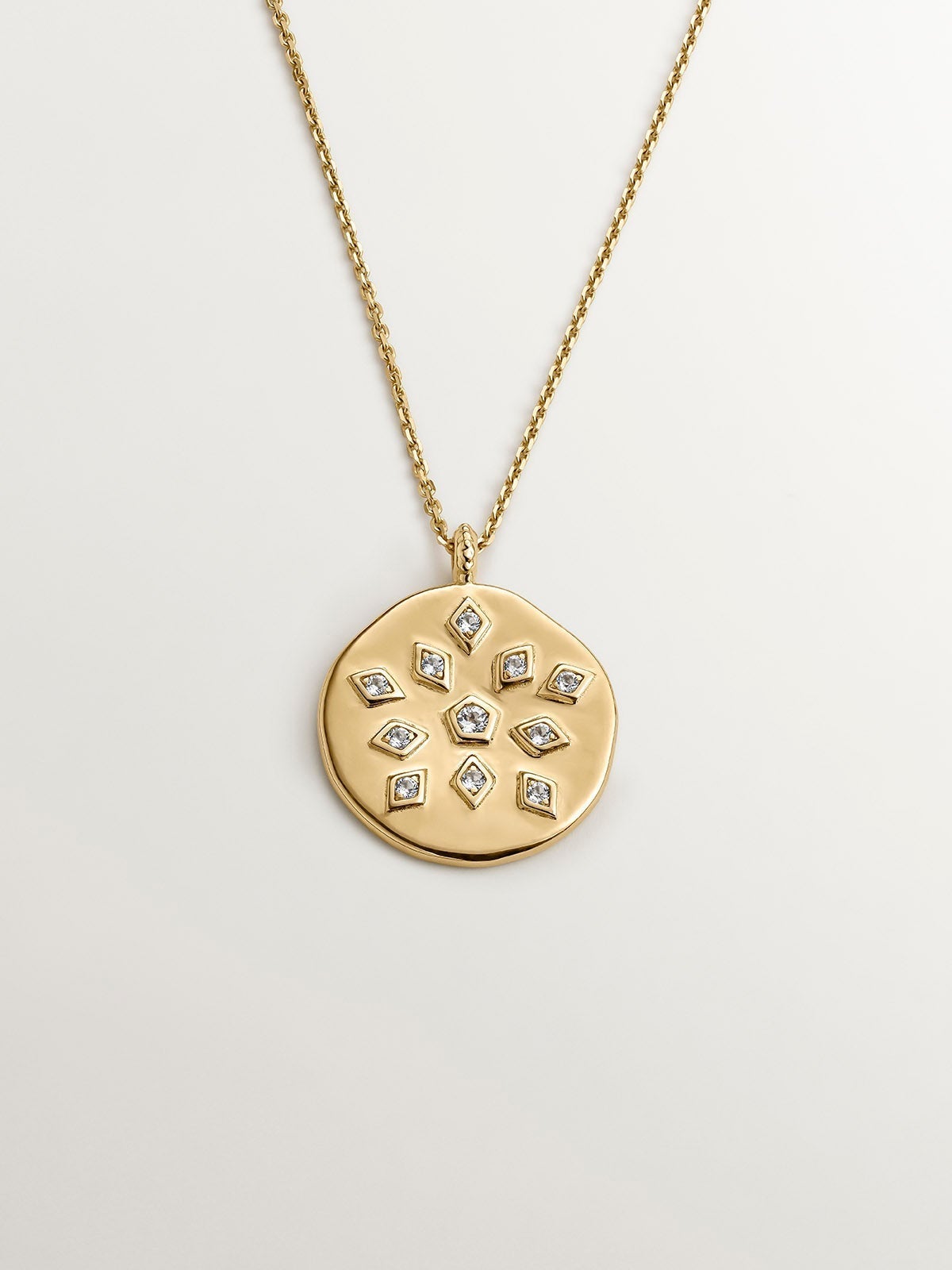 925 Silver pendant bathed in 18K yellow gold with medal and white topaz.