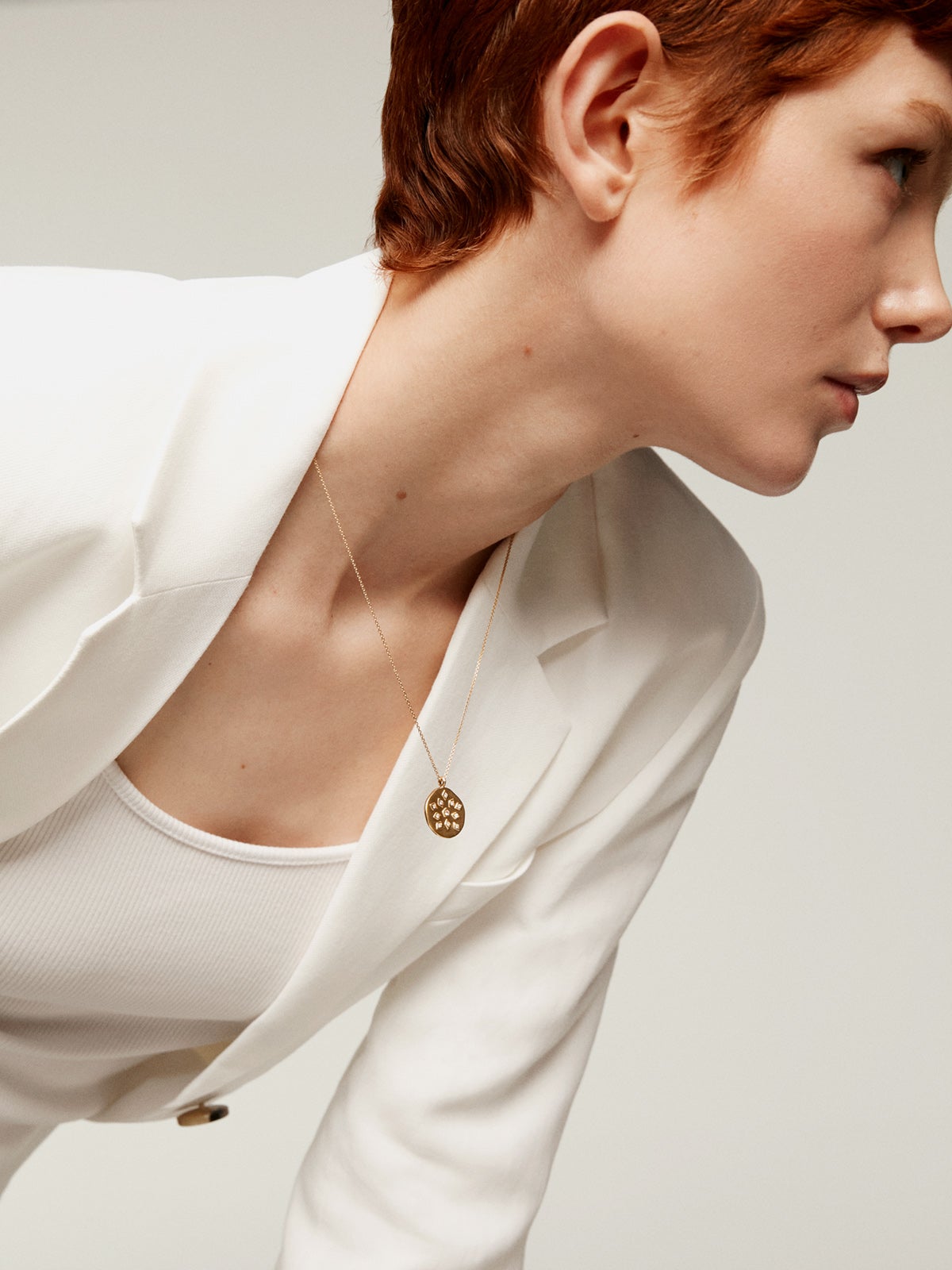 925 Silver pendant bathed in 18K yellow gold with medal and white topaz.