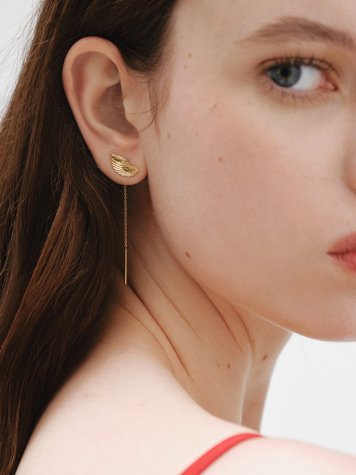 Long 925 silver earrings bathed in 18K yellow gold with wings
