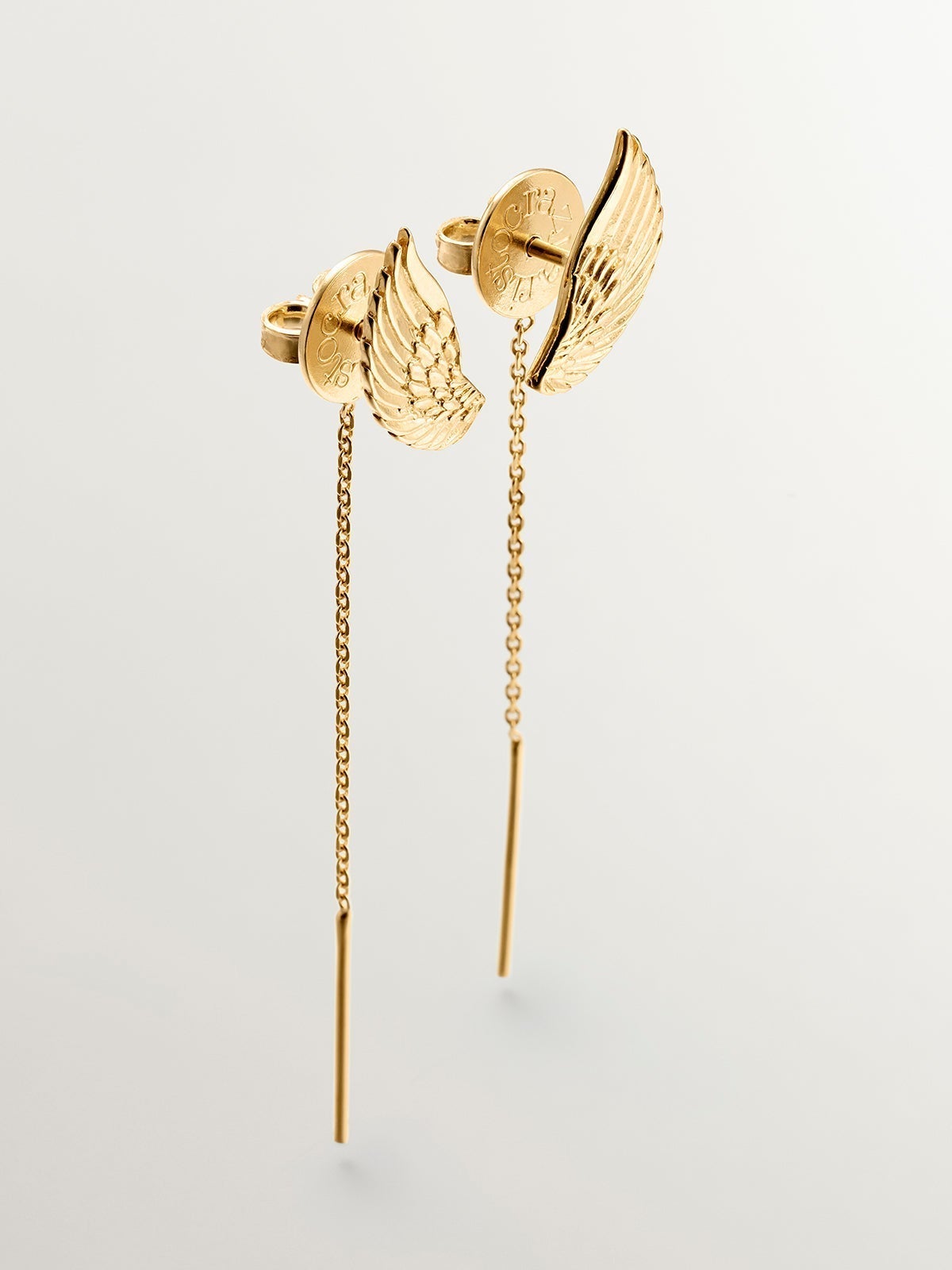 Long 925 silver earrings bathed in 18K yellow gold with wings