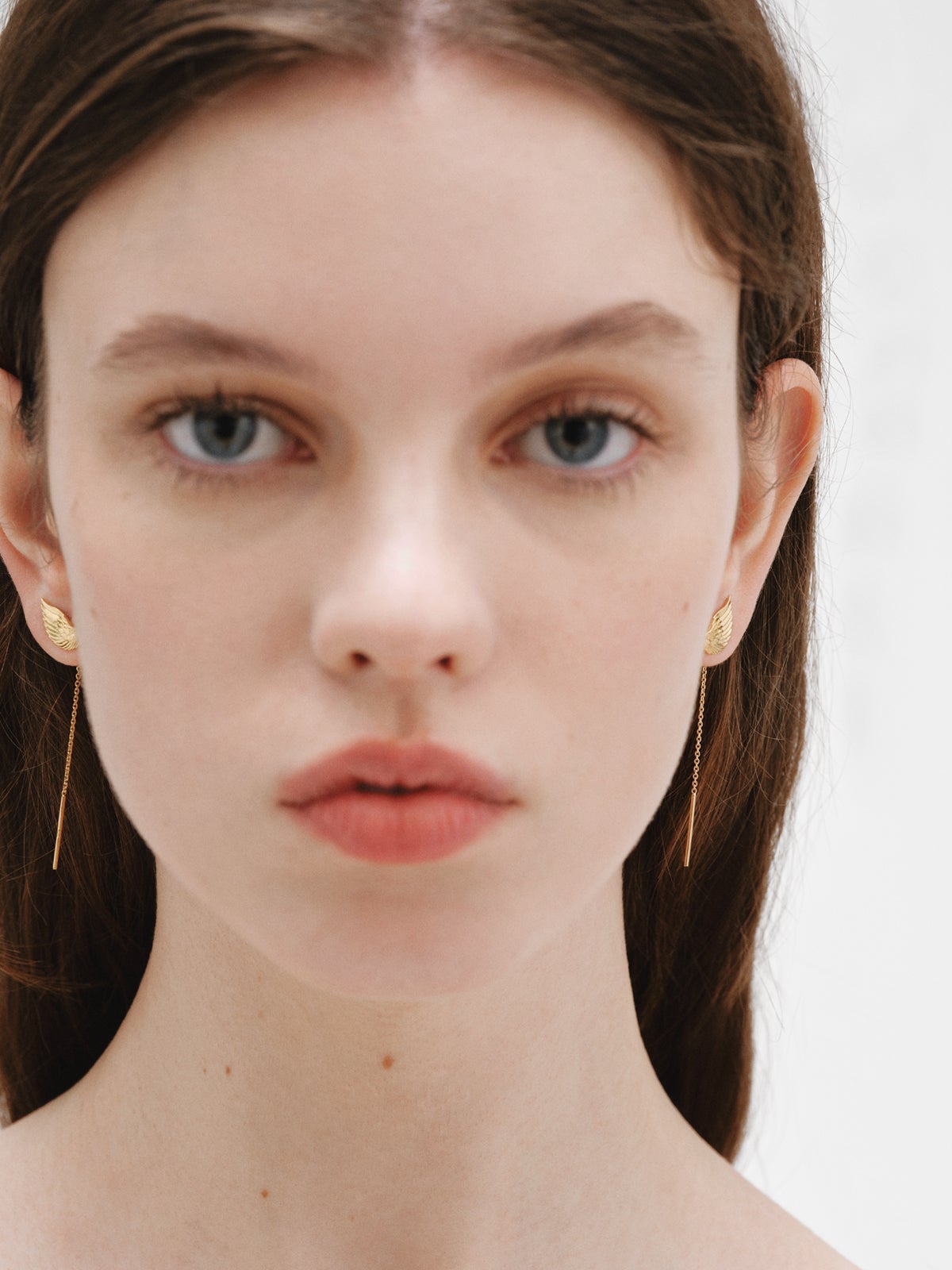 Long 925 silver earrings bathed in 18K yellow gold with wings