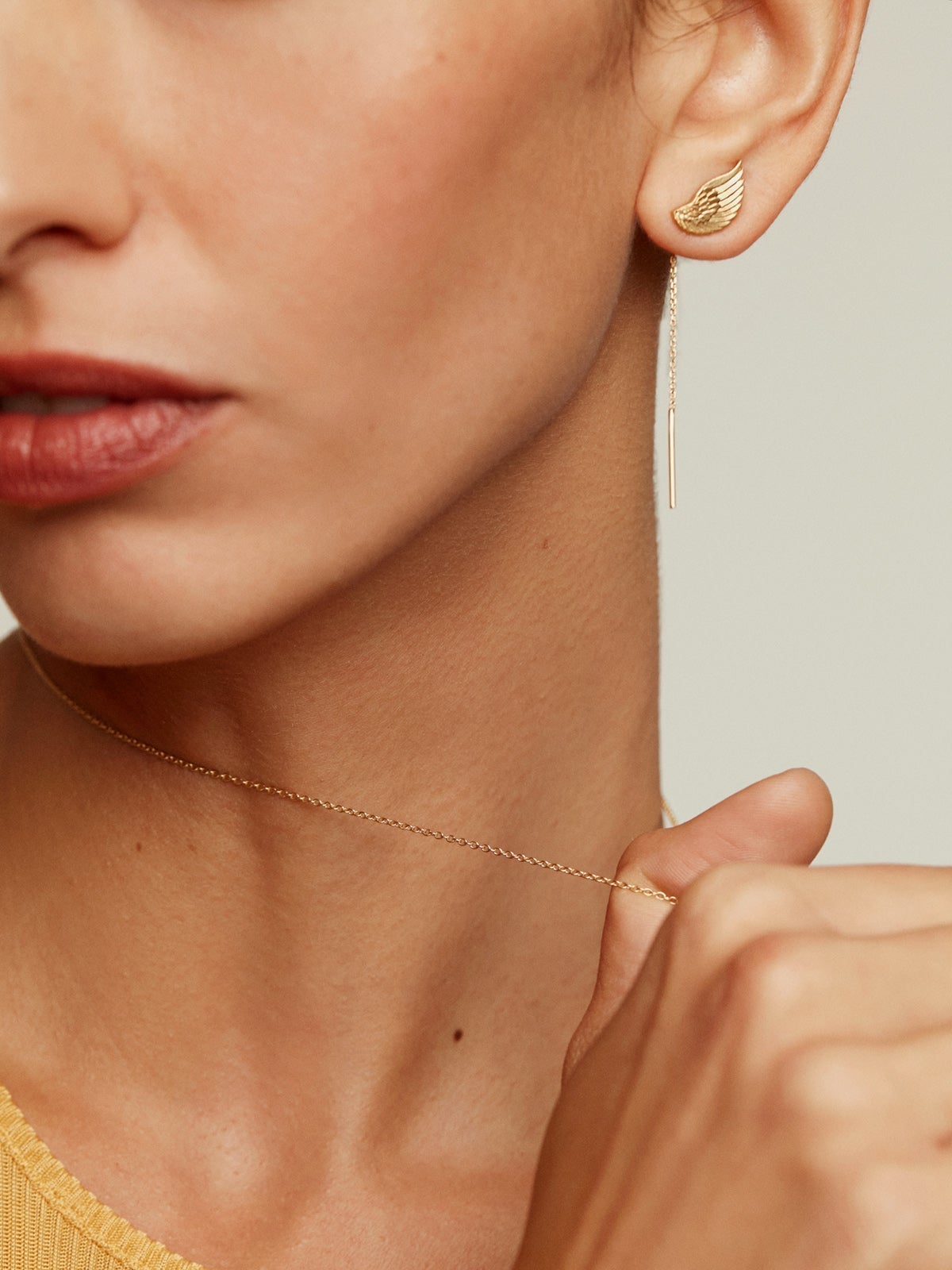 Long 925 silver earrings bathed in 18K yellow gold with wings