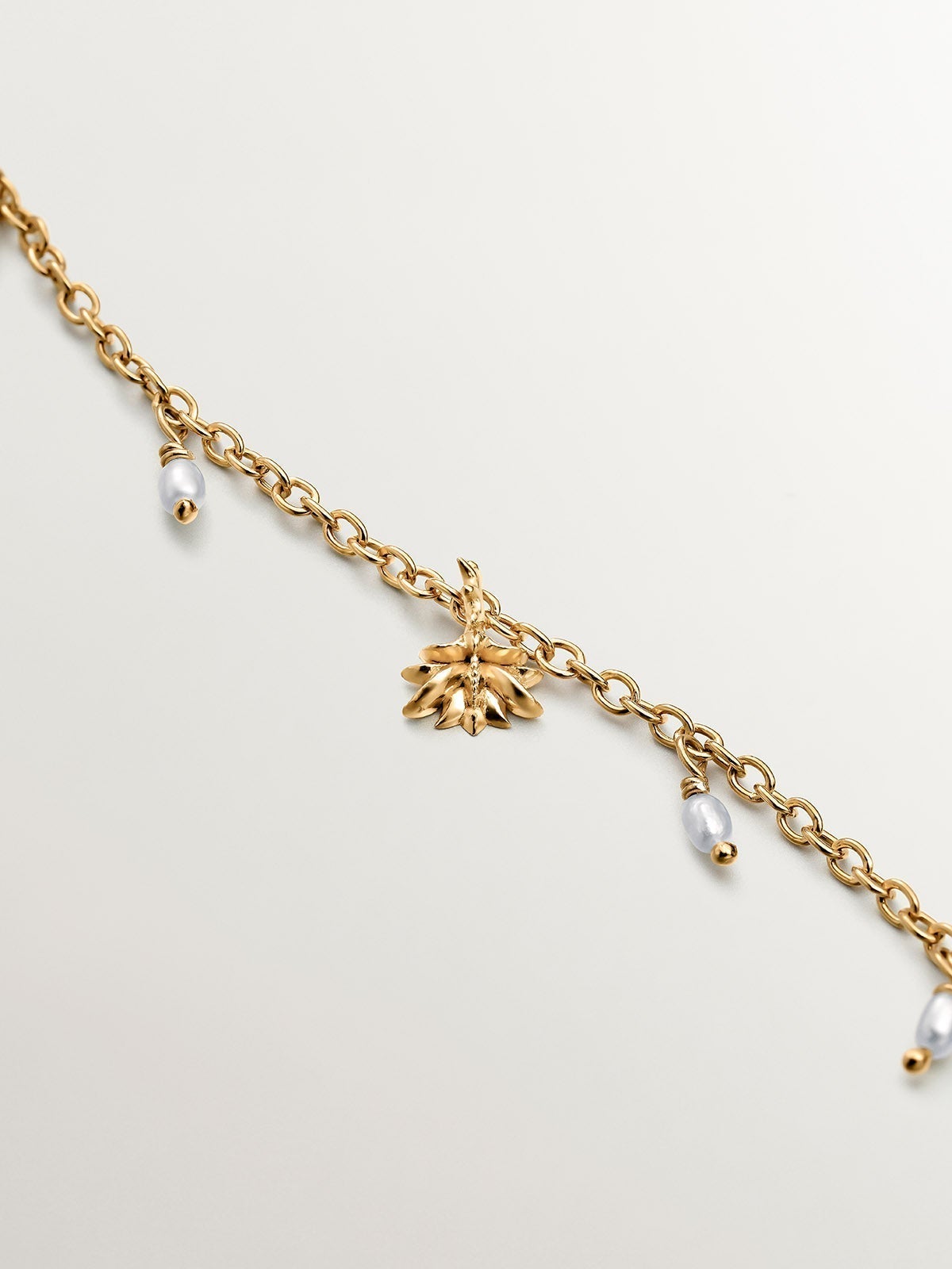 925 Silver bracelet dipped in 18K yellow gold with river pearls and water lily.