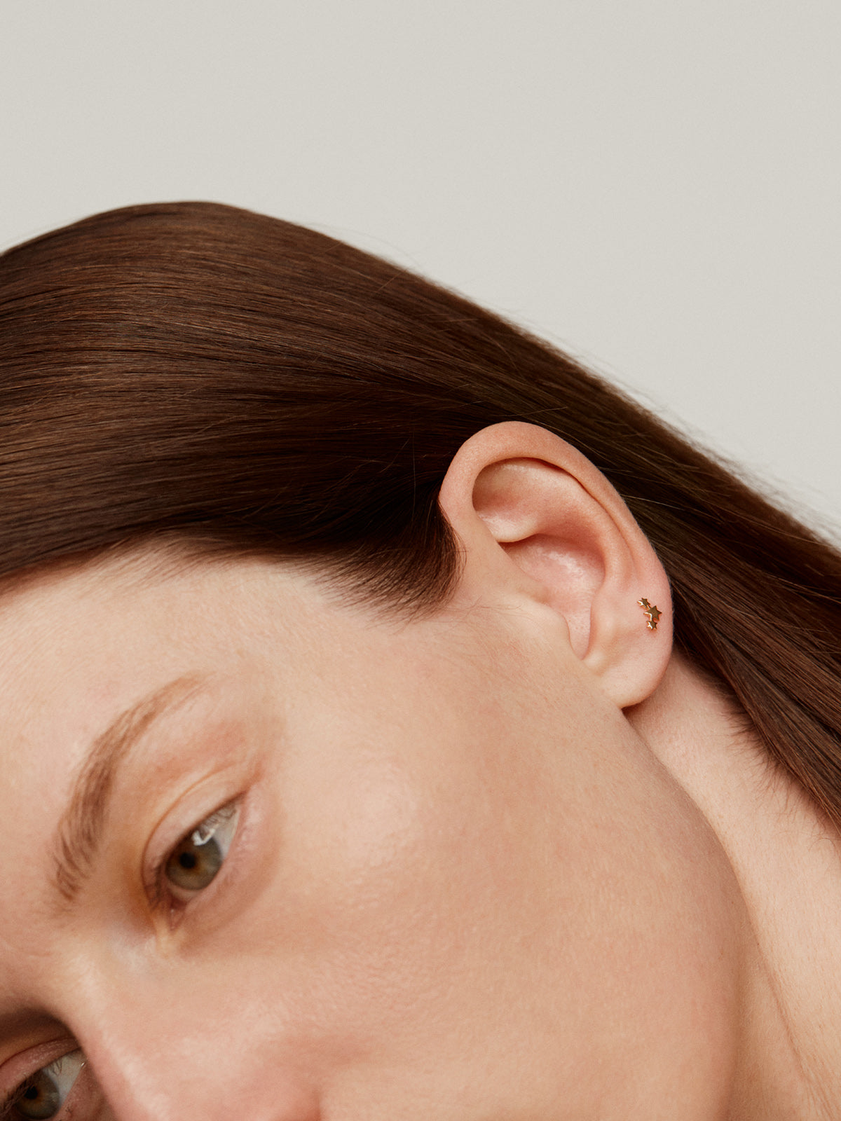 18K yellow gold piercing with triple star