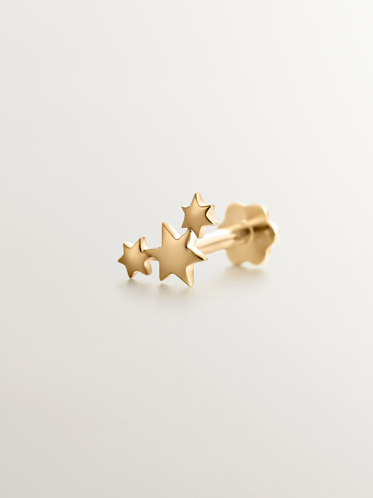 18K yellow gold piercing with triple star