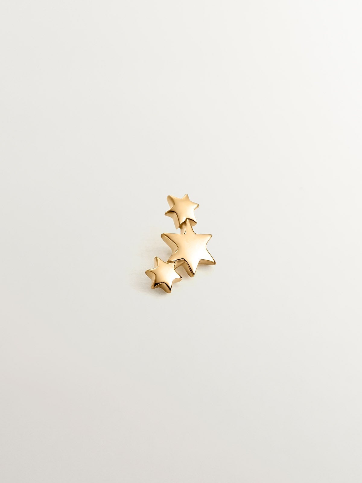 18K yellow gold piercing with triple star