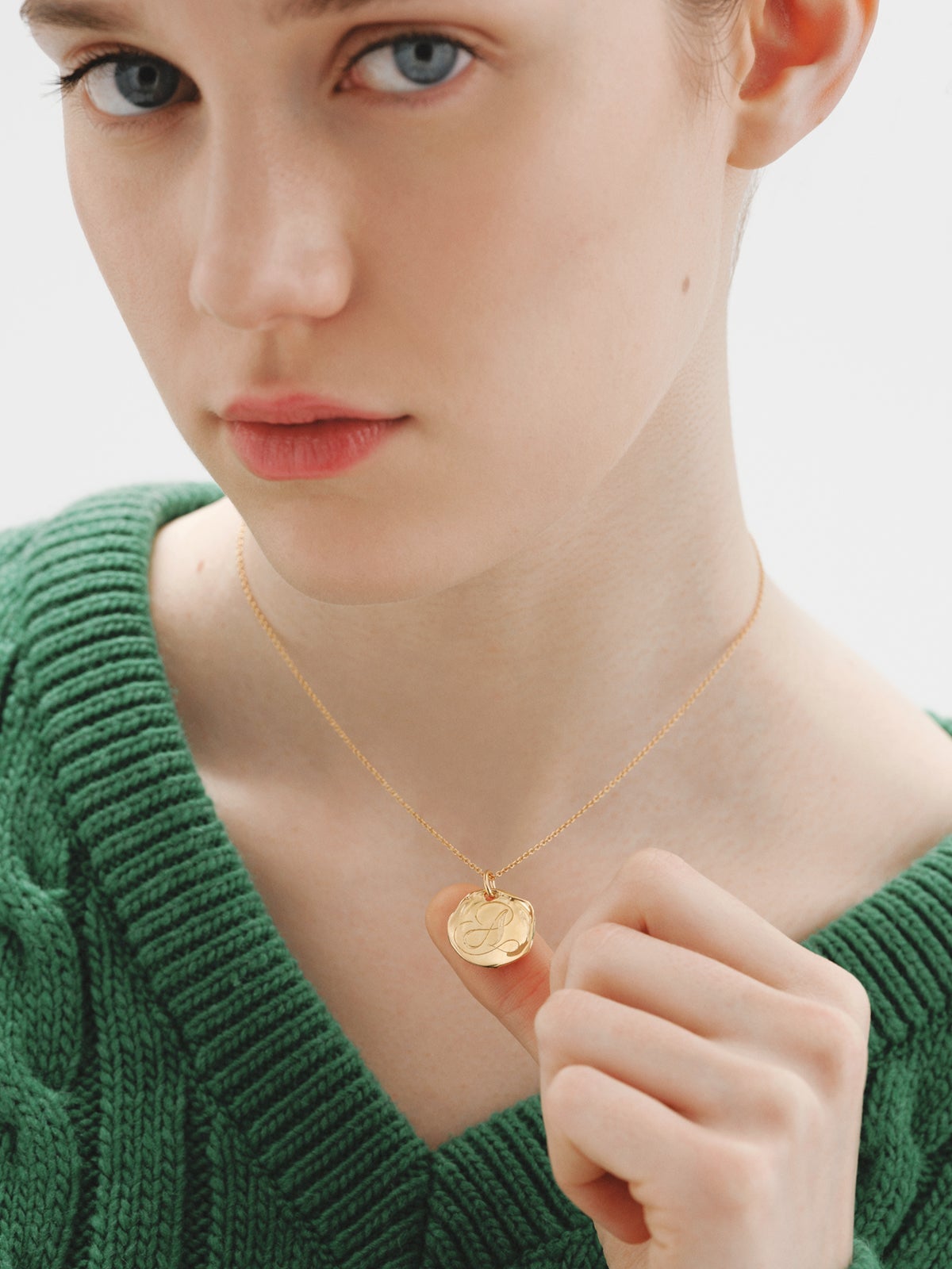 Handcrafted 925 silver charm bathed in 18K yellow gold with initial A.