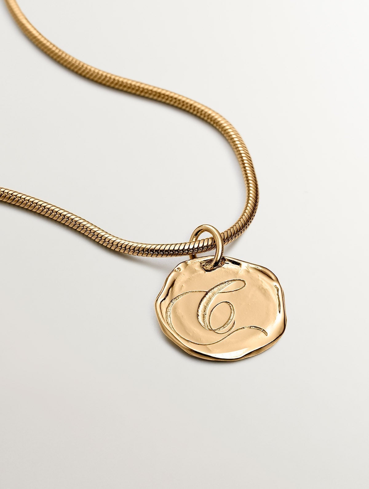 Handcrafted charm made of 925 silver, plated in 18K yellow gold with the initial C.