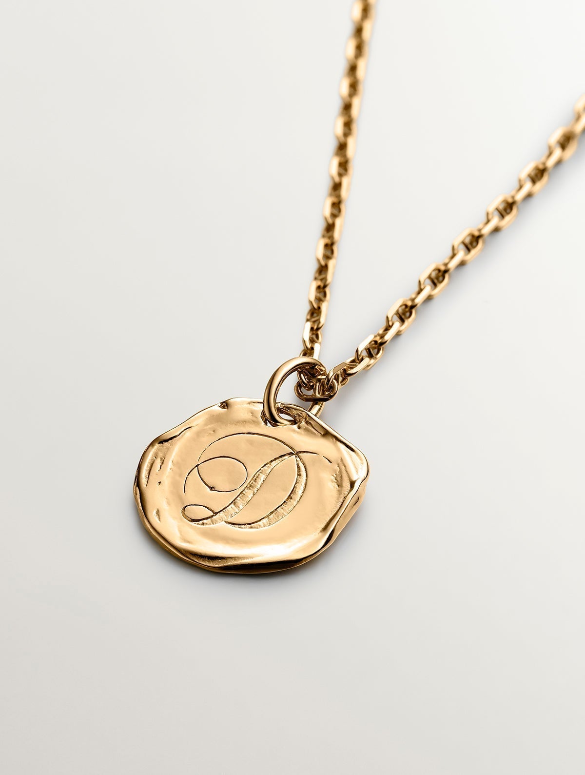 Handmade 925 silver charm plated in 18K yellow gold with initial D