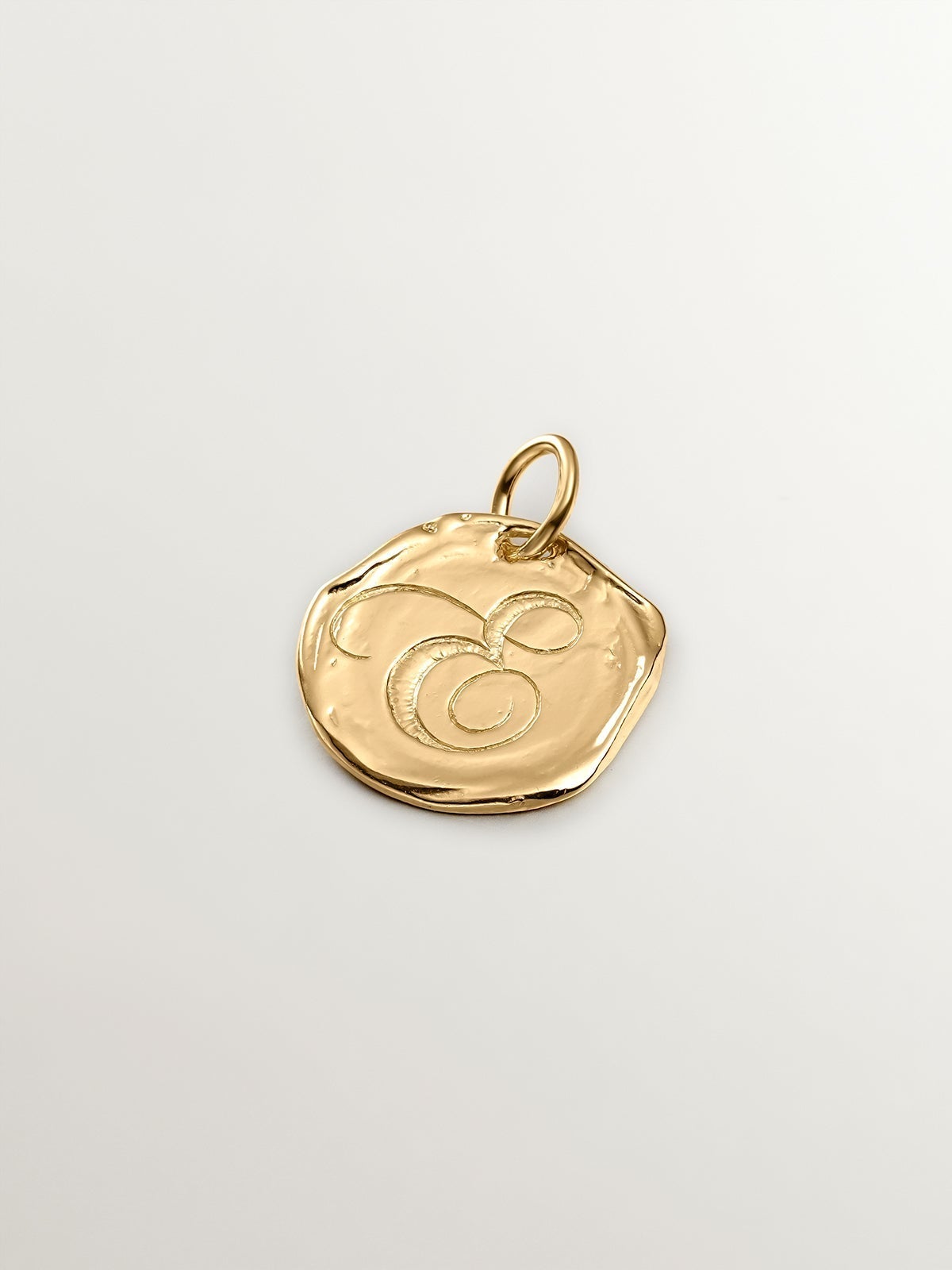 Handcrafted 925 silver charm bathed in 18K yellow gold with the initial E.
