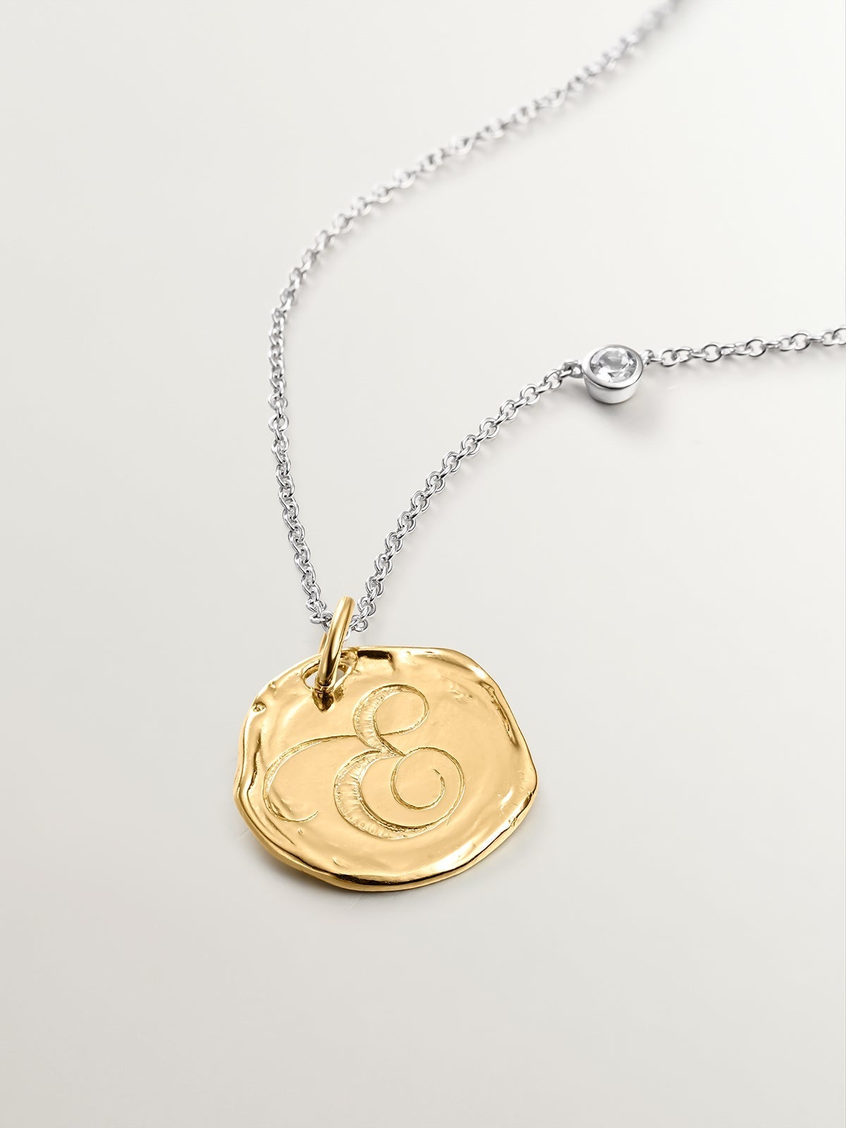 Handcrafted 925 silver charm bathed in 18K yellow gold with the initial E.