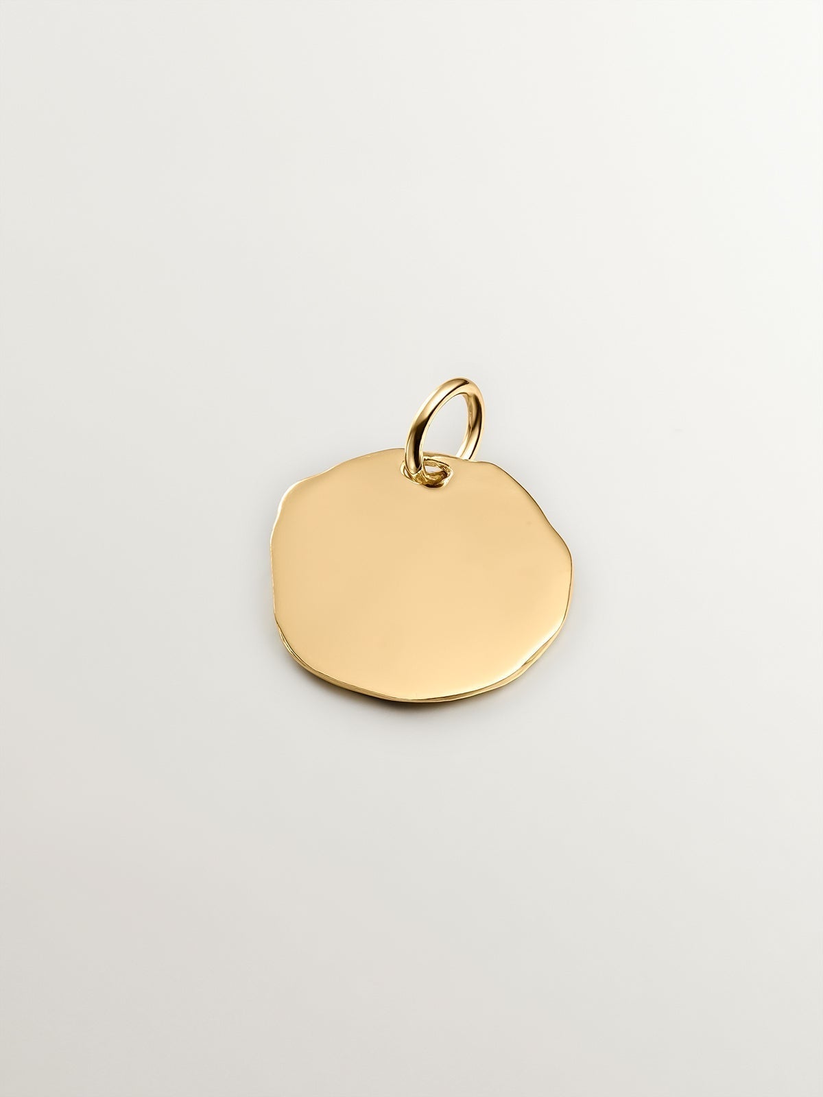 Handcrafted charm made of 925 silver, bathed in 18K yellow gold with initial F.