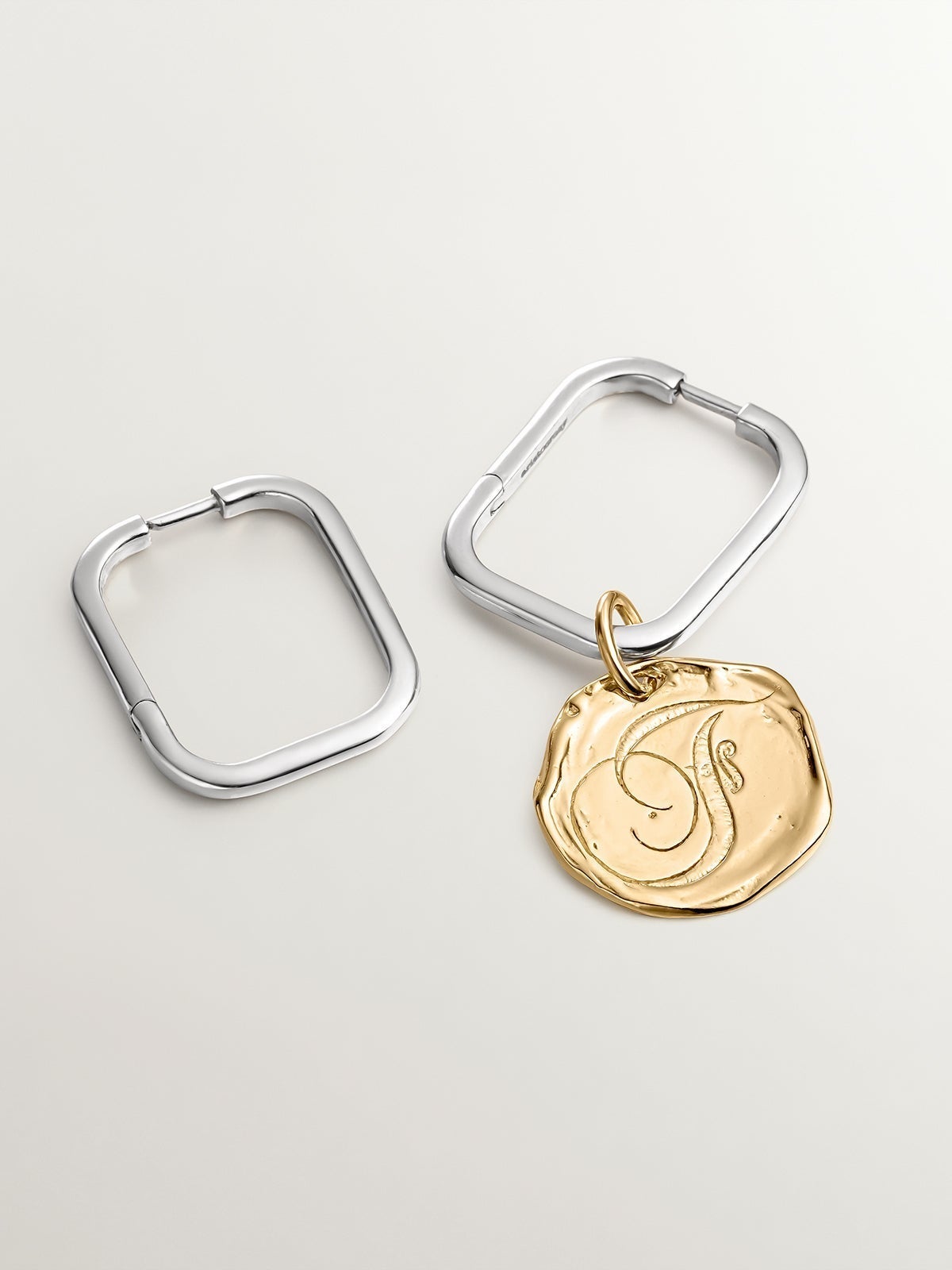 Handcrafted charm made of 925 silver, bathed in 18K yellow gold with initial F.