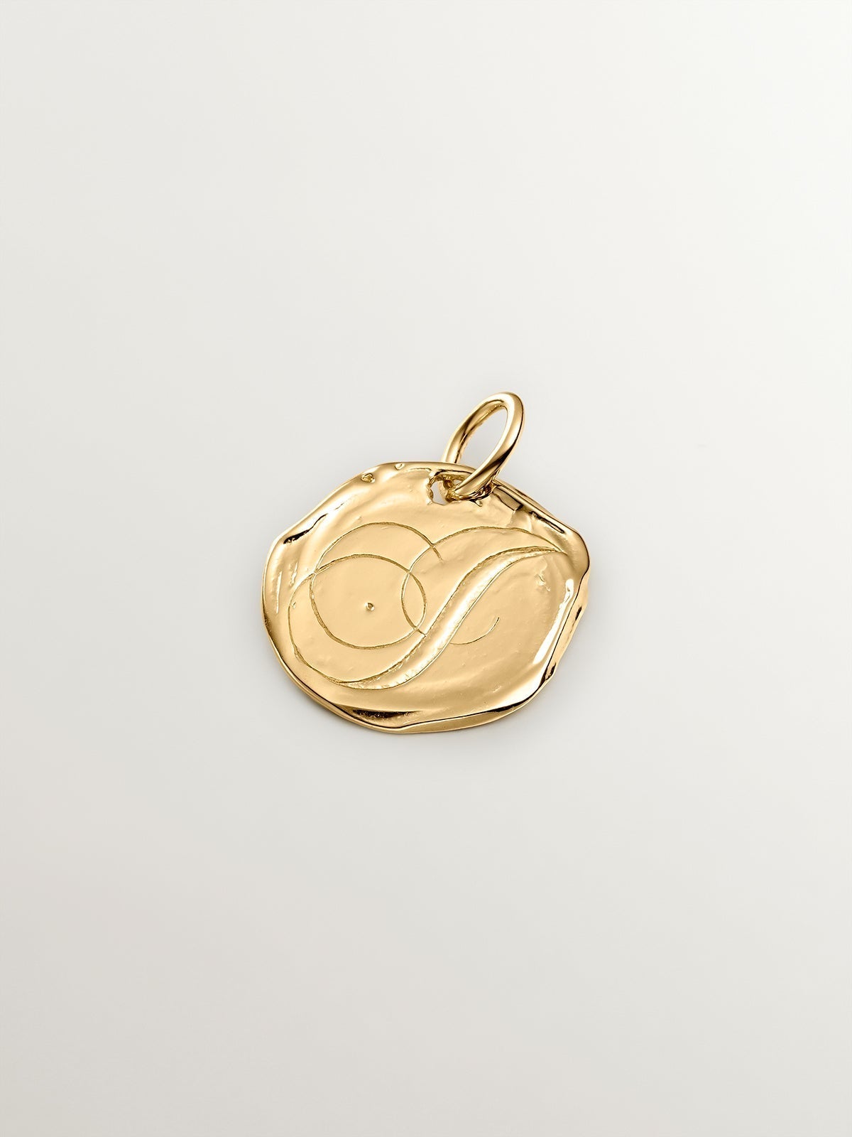 Handcrafted charm made of 925 silver, coated in 18K yellow gold with the initial I.