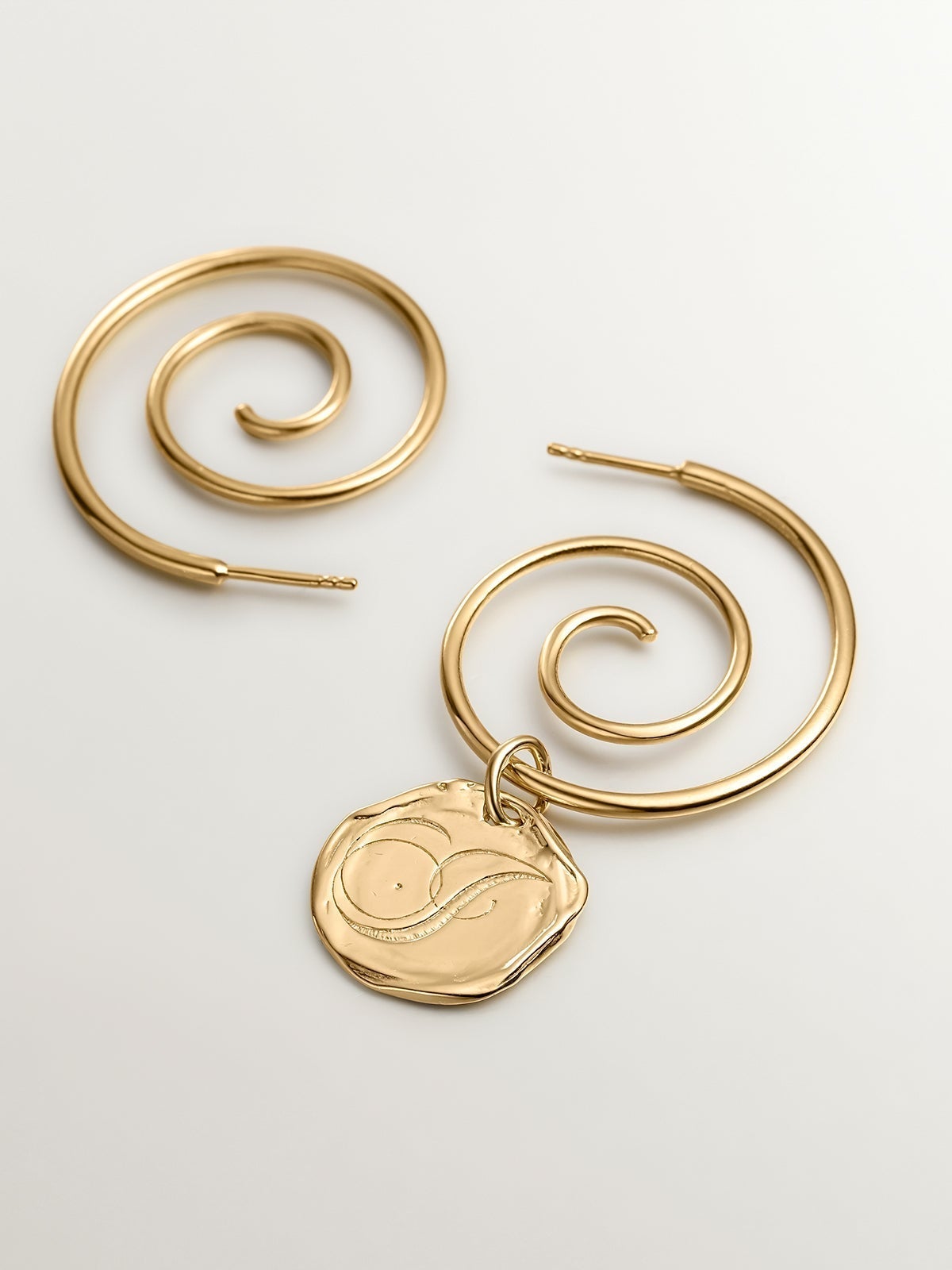 Handcrafted charm made of 925 silver, bathed in 18K yellow gold with initial J.