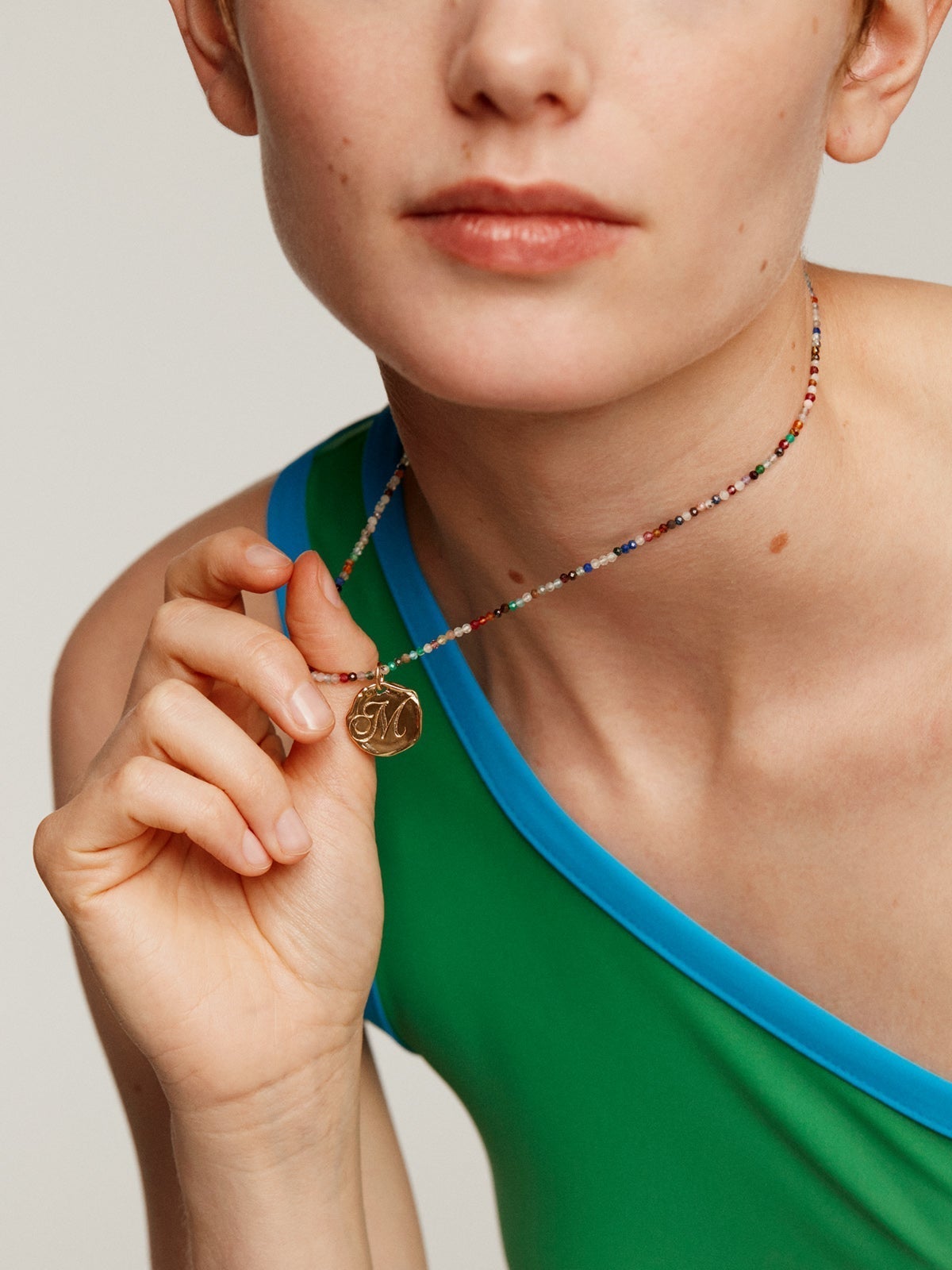 Handcrafted 925 silver charm, bathed in 18K yellow gold with initial K.