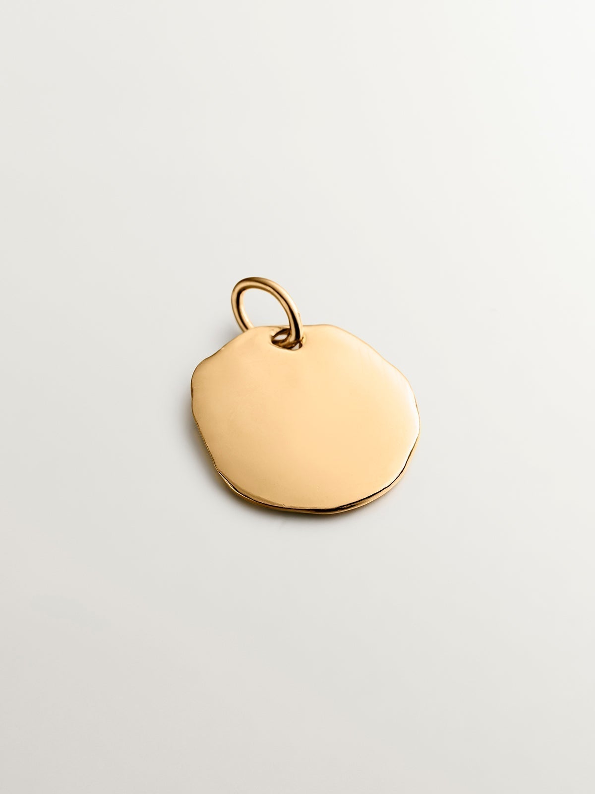 Handcrafted 925 silver charm bathed in 18K yellow gold with an initial L