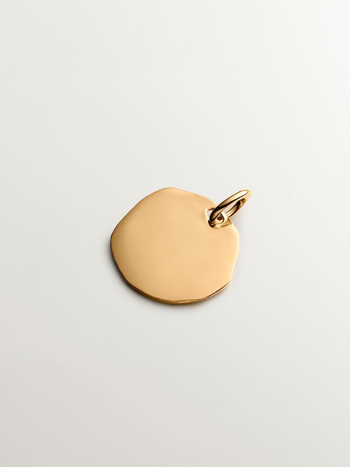 Handcrafted charm made of 925 silver bathed in 18K yellow gold with initial M.
