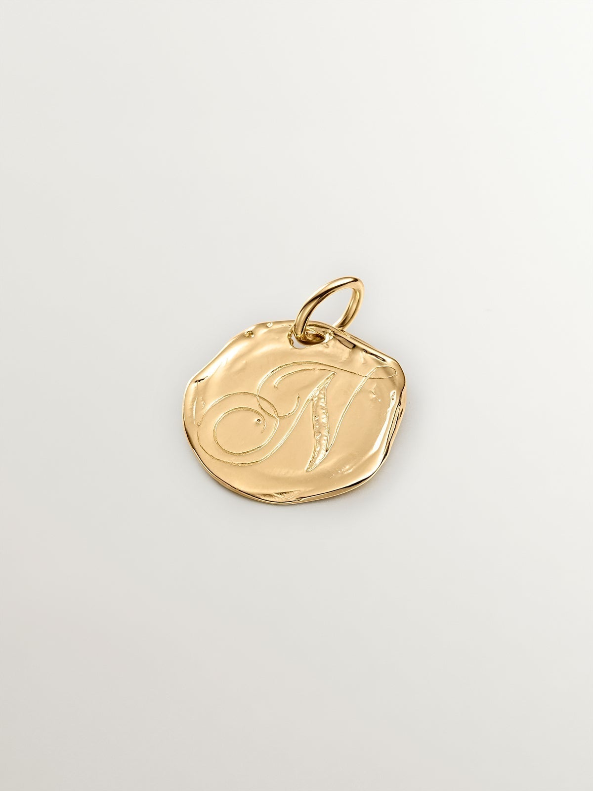 Handcrafted 925 silver charm bathed in 18K yellow gold with initial N