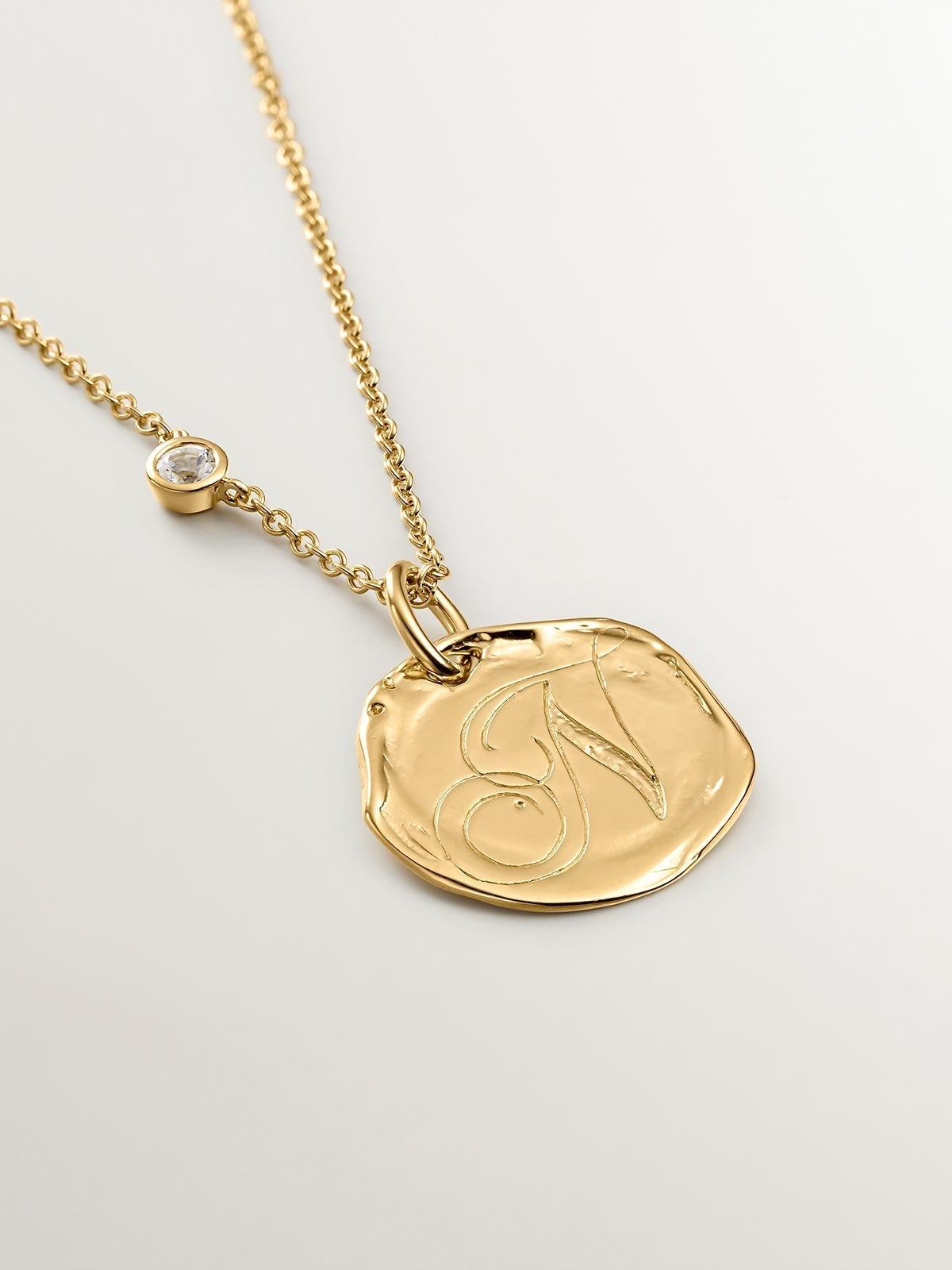 Handcrafted 925 silver charm bathed in 18K yellow gold with initial N