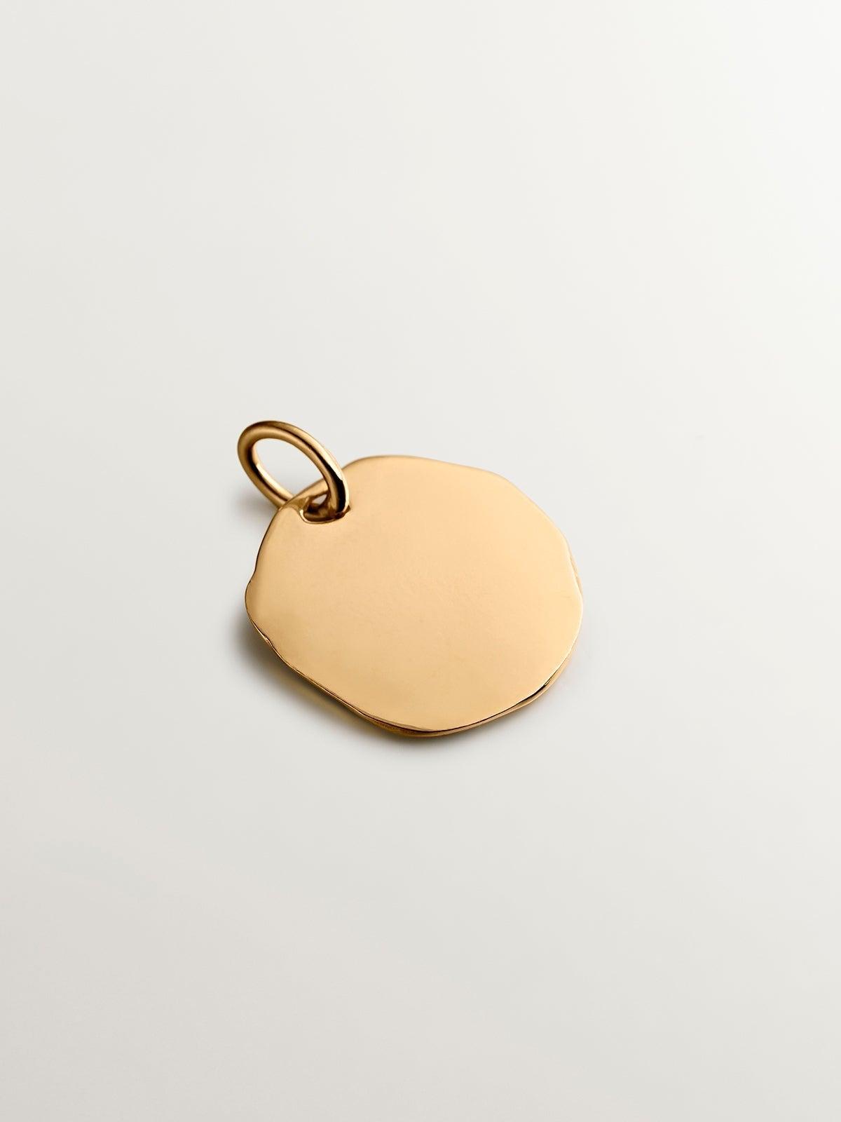 Handcrafted 925 silver charm bathed in 18K yellow gold with initial P.