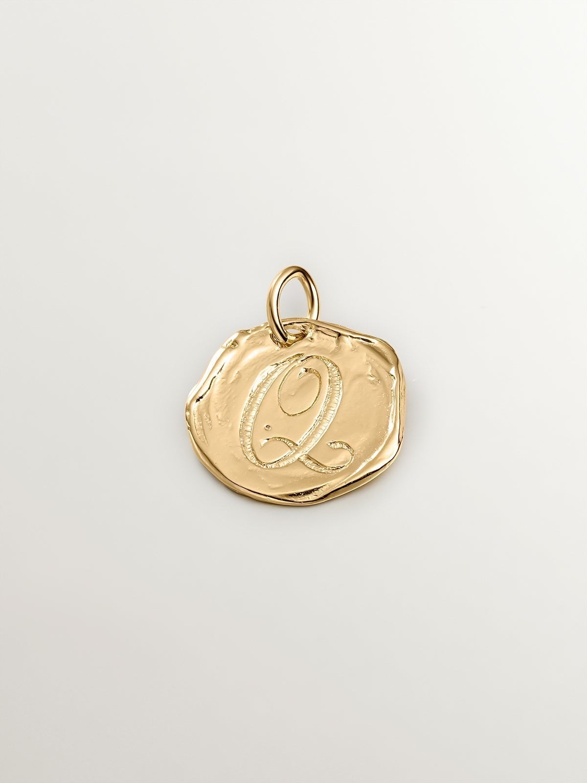 Handcrafted charm made of 925 silver coated in 18K yellow gold with the initial Q.