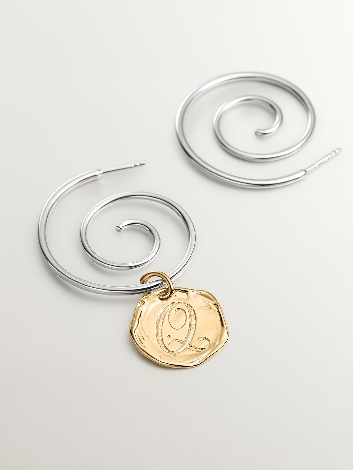 Handcrafted charm made of 925 silver coated in 18K yellow gold with the initial Q.